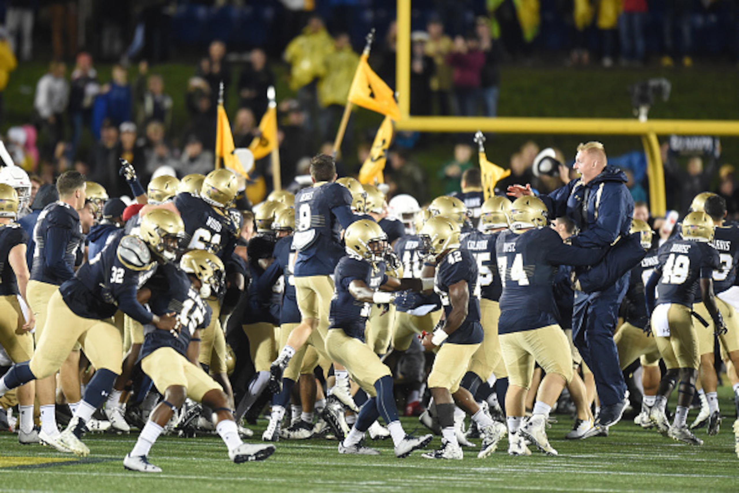 Navy's 46-40 win over Houston had the biggest impact on this week's Associated Press and Amway polls. Navy's 46-40 win over Houston had the biggest impact on this week's Associated Press and Amway polls.
