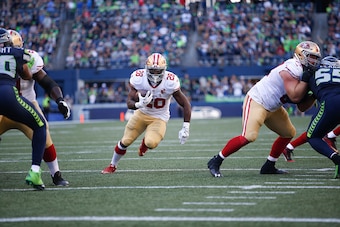 SEATTLE, WA - SEPTEMBER 25: Carlos Hyde #28 of the San Francisco 49ers rushes during the game against the Seattle Seahawks at CenturyLink Field on September 25, 2016 in Seattle, Washington. The Seahawks defeated the 49ers 38-18. (Photo by Michael Zagaris/