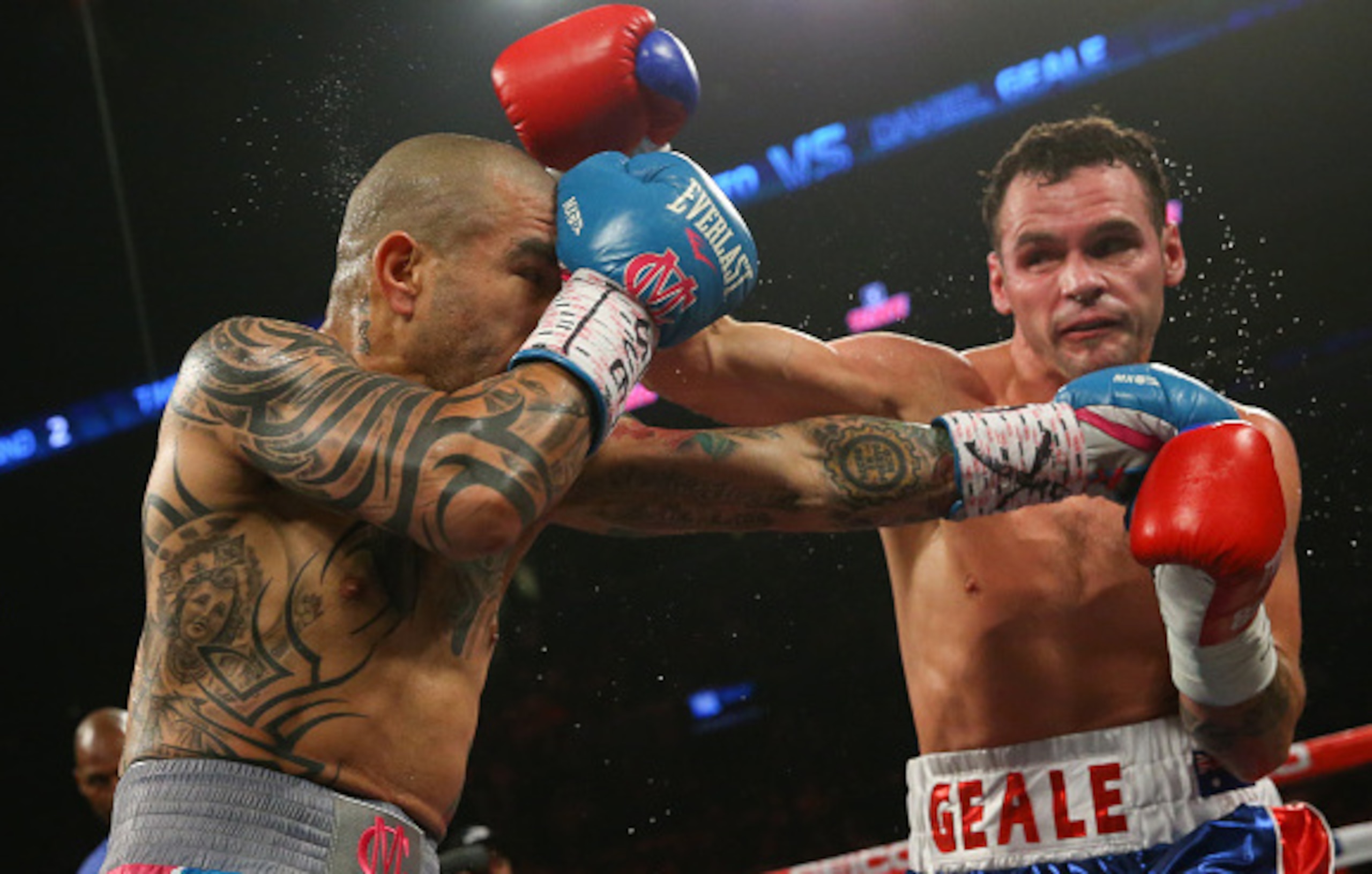 NEW YORK, NY - JUNE 6: Miguel Cotto (L) and Daniel Geale exchange punches during their WBC middleweight world championship fight at the Barclays Center on June 6, 2015 in the Brooklyn borough of New York City. (Photo by Ed Mulholland/Getty Images)