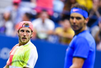 Lucas Pouille eyes Rafael Nadal during their match at the 2016 U.S. Open.
