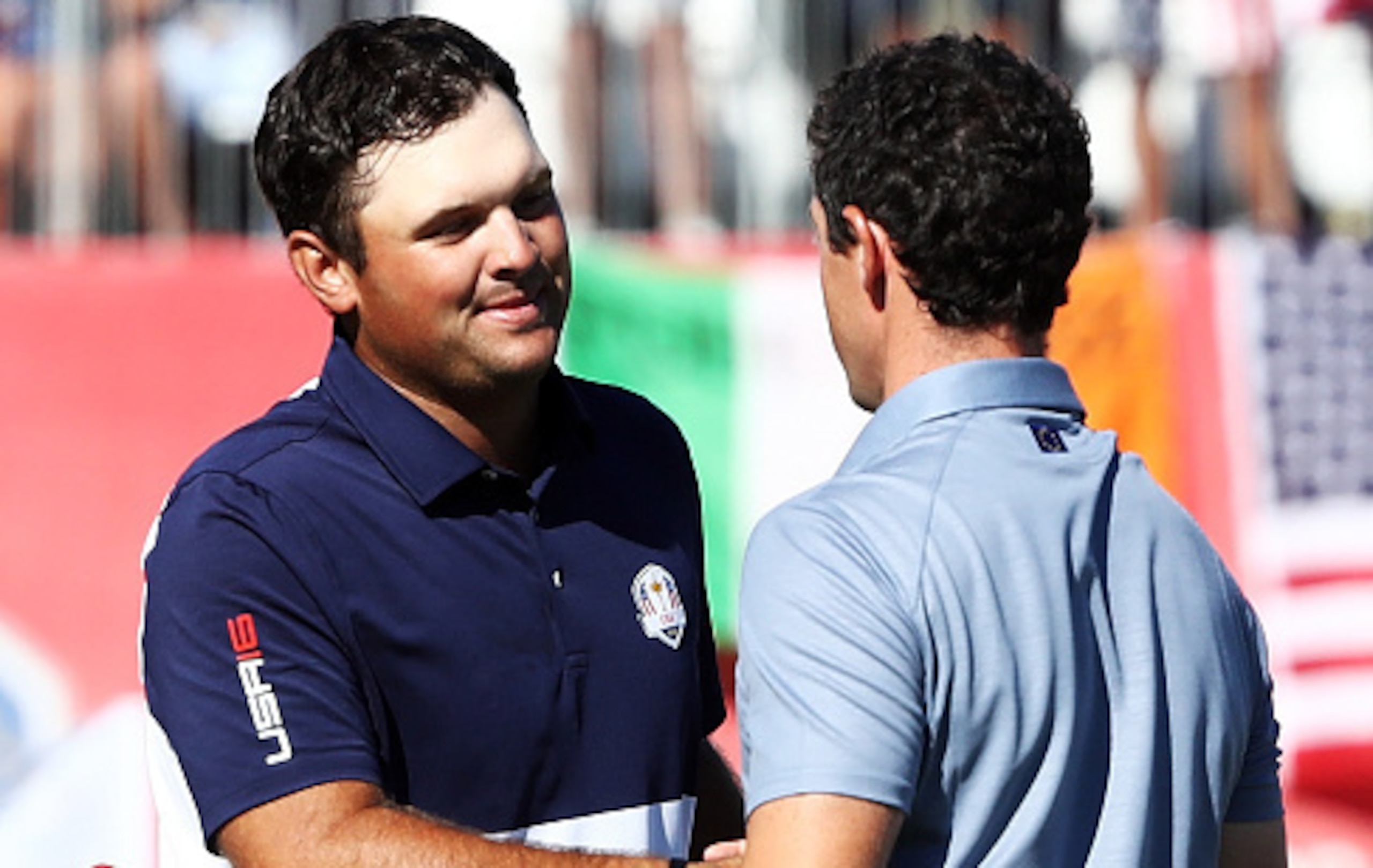 Patrick Reed (left) and Rory McIlroy