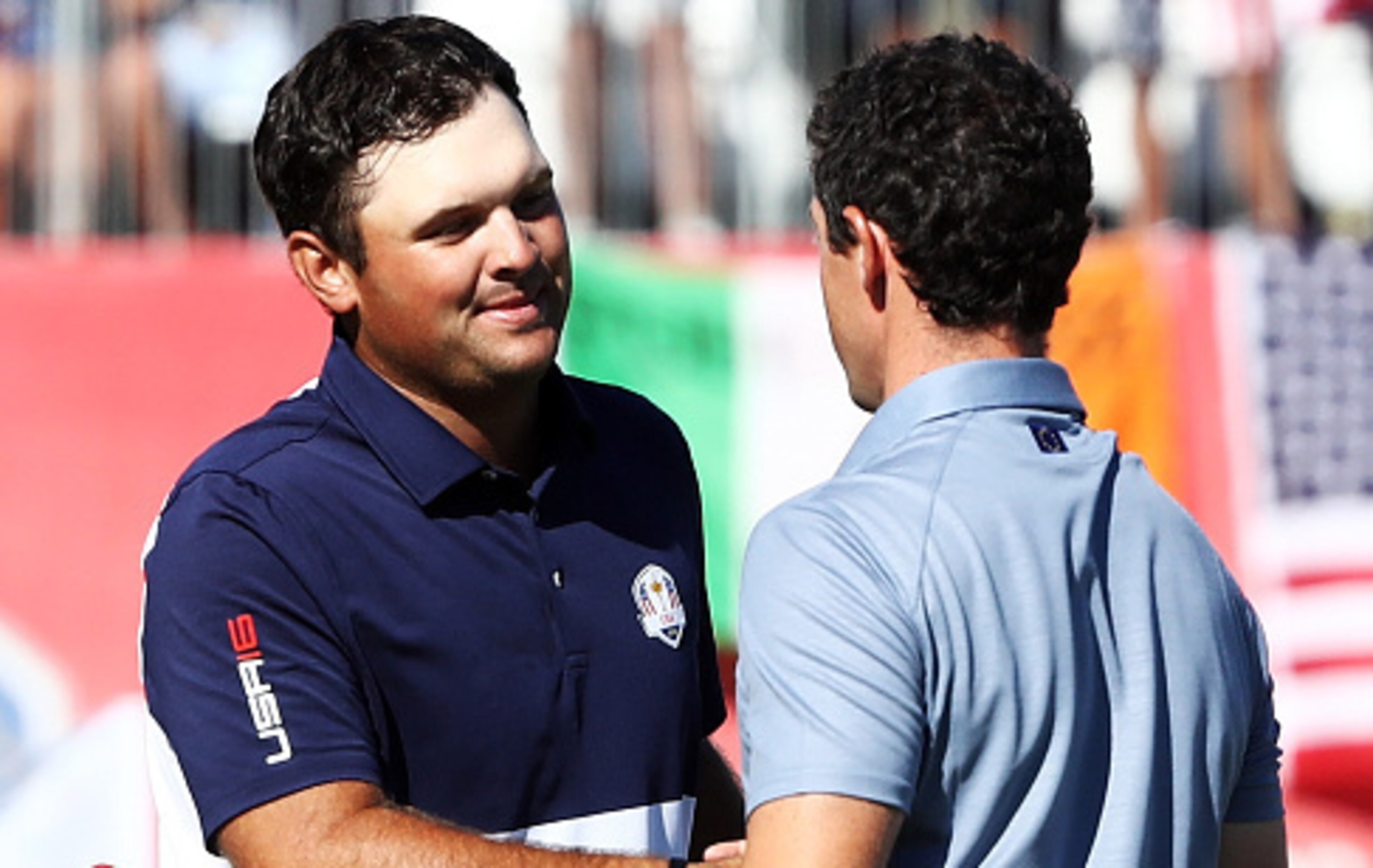 Patrick Reed (left) and Rory McIlroy