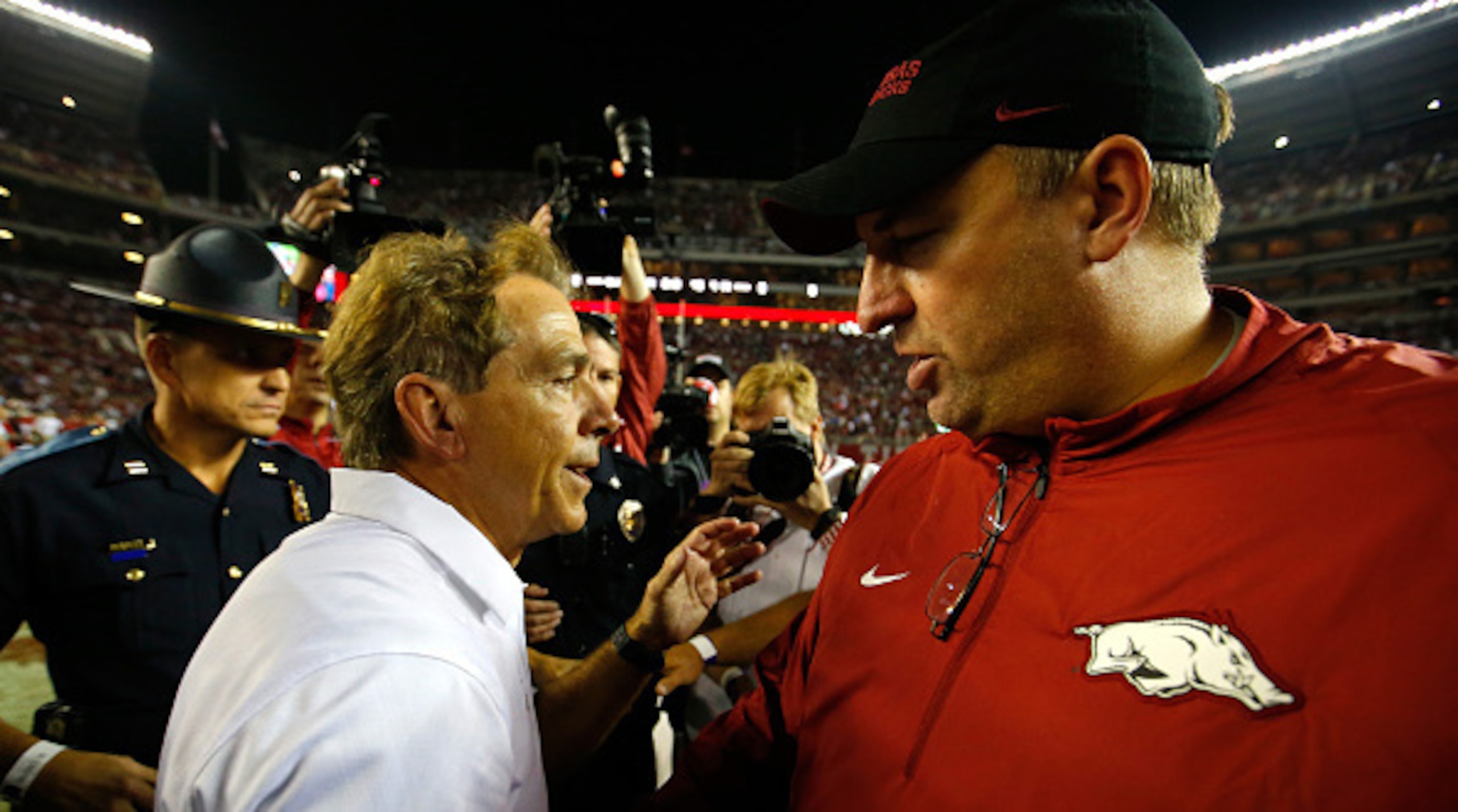 Bret Bielema, right, is still looking for his first win against Nick Saban.