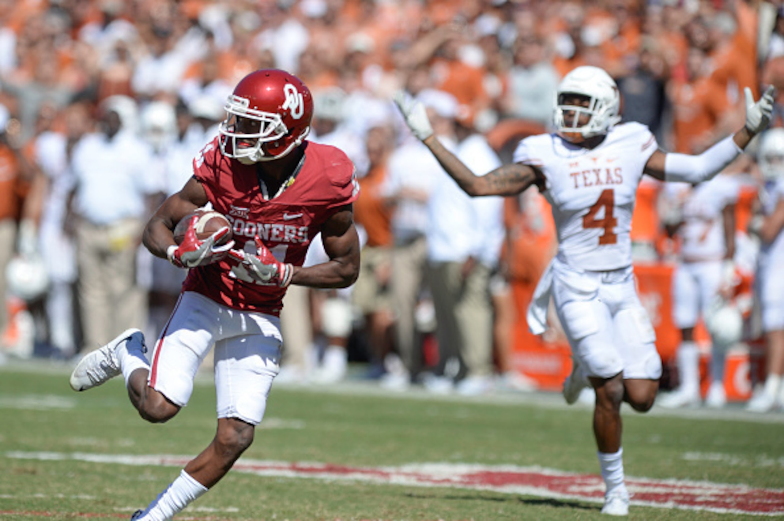 Texas' DeShon Elliott (4) wasn't the only one who couldn't figure out how to slow down Oklahoma's Dede Westbrook (11). Texas' DeShon Elliott (4) wasn't the only one who couldn't figure out how to slow down Oklahoma's Dede Westbrook (11).