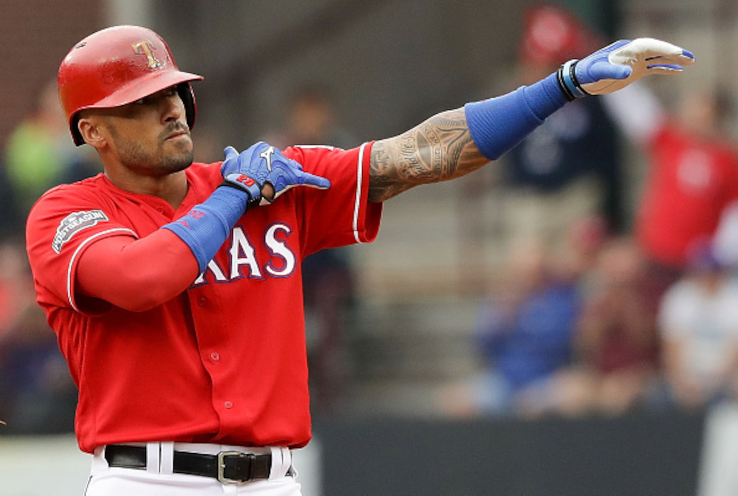 ARLINGTON, TX - OCTOBER 07:  Ian Desmond #20 of the Texas Rangers reacts after hitting a double against the Toronto Blue Jays in the seventh inning of game two of the American League Divison Series at Globe Life Park in Arlington on October 7, 2016 in Arl