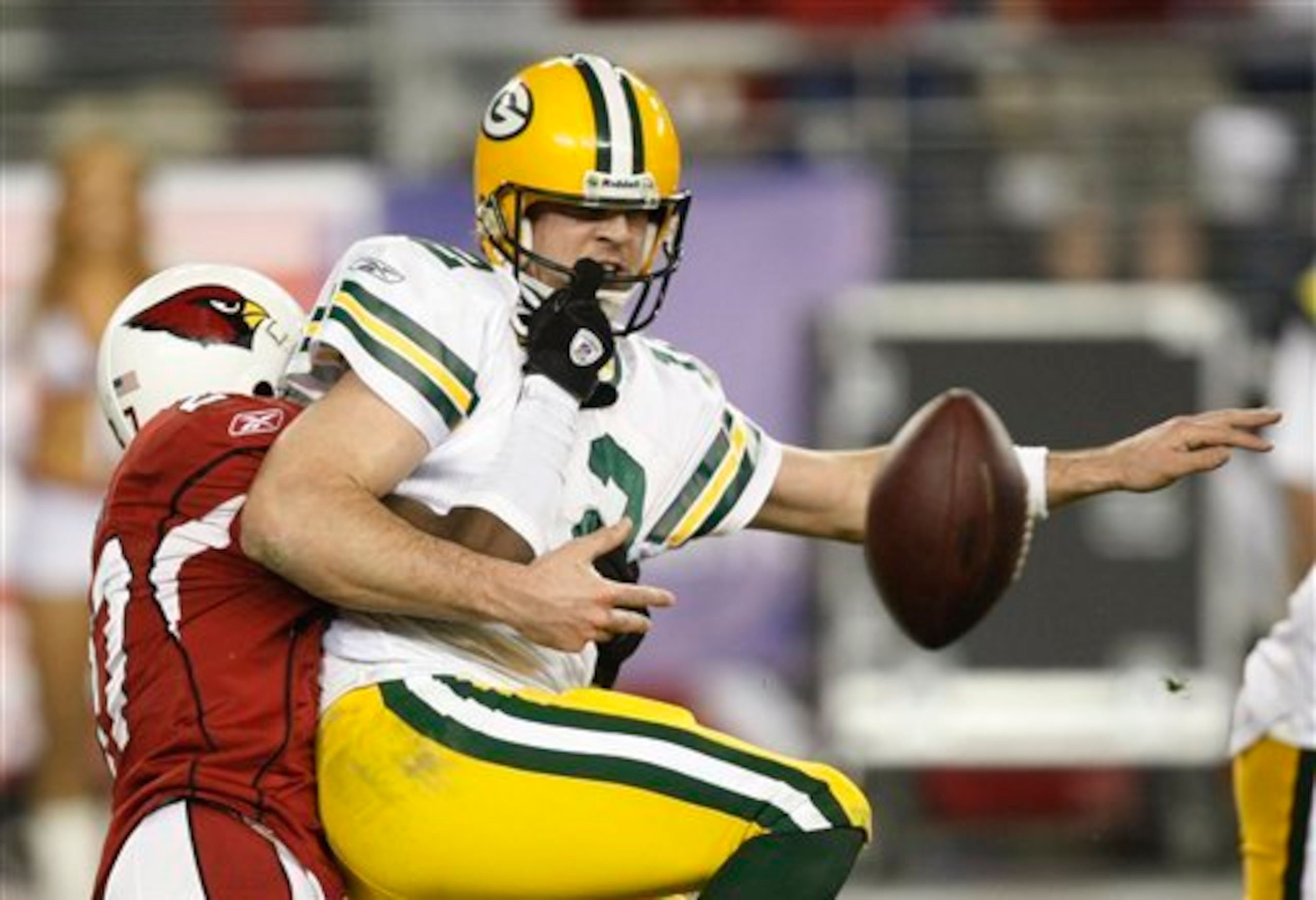 Aaron Rodgers' spectacular playoff debut ended with a fumble that should have been reversed due to a facemask grab.