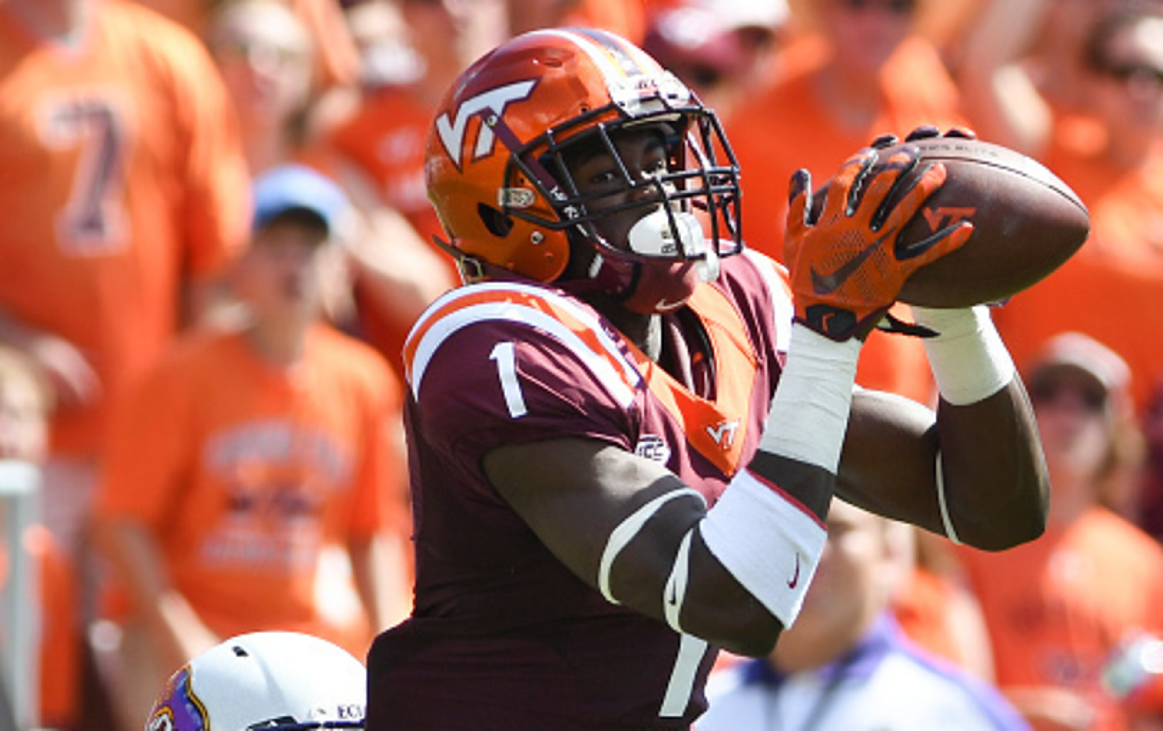 BLACKSBURG, VA - SEPTEMBER 24: Wide receiver Isaiah Ford #1 of the Virginia Tech Hokies makes a reception while being defended by defensive back Corey Seargent #5 of the East Carolina Pirates in the first half at Lane Stadium on September 24, 2016 in Blac