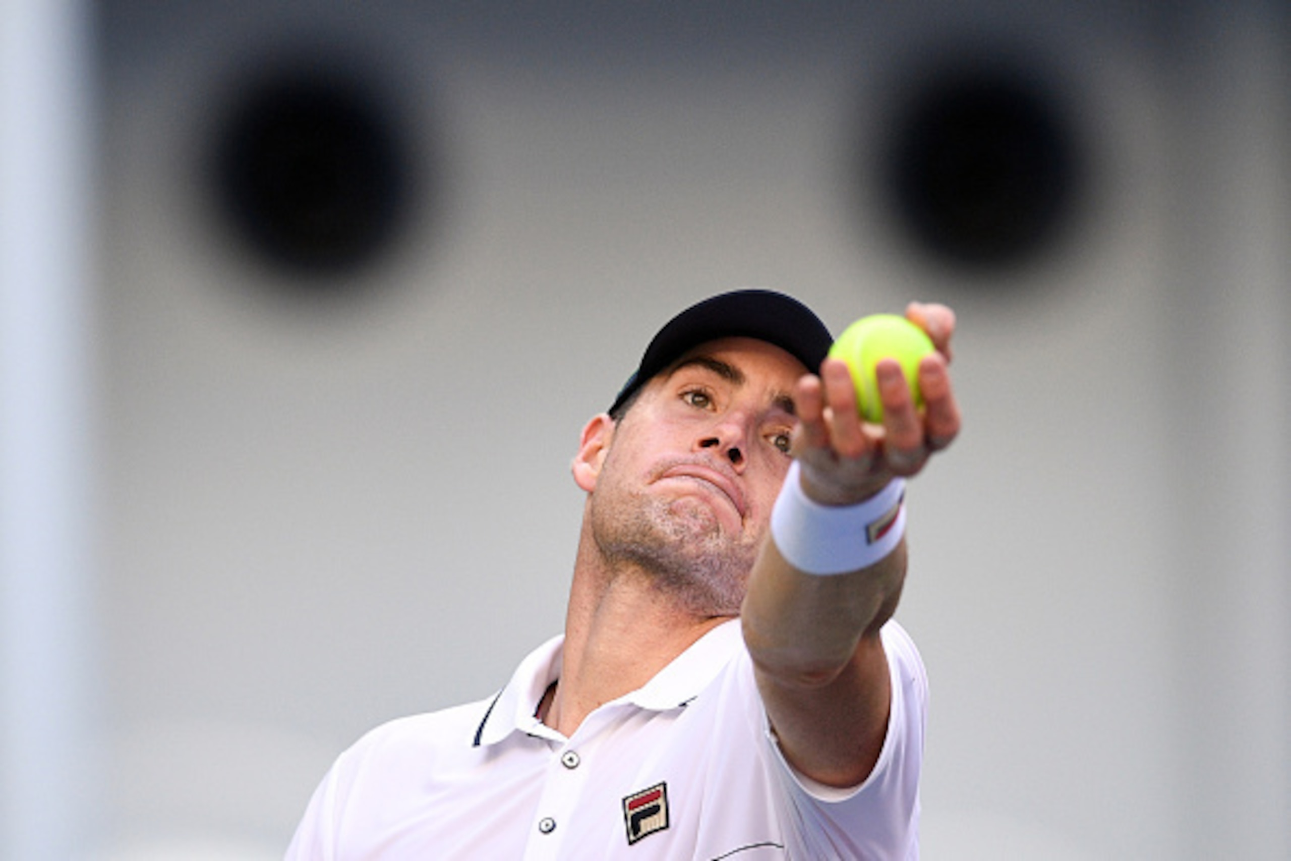 John Isner prepares to serve during a match at the 2016 China Open.
