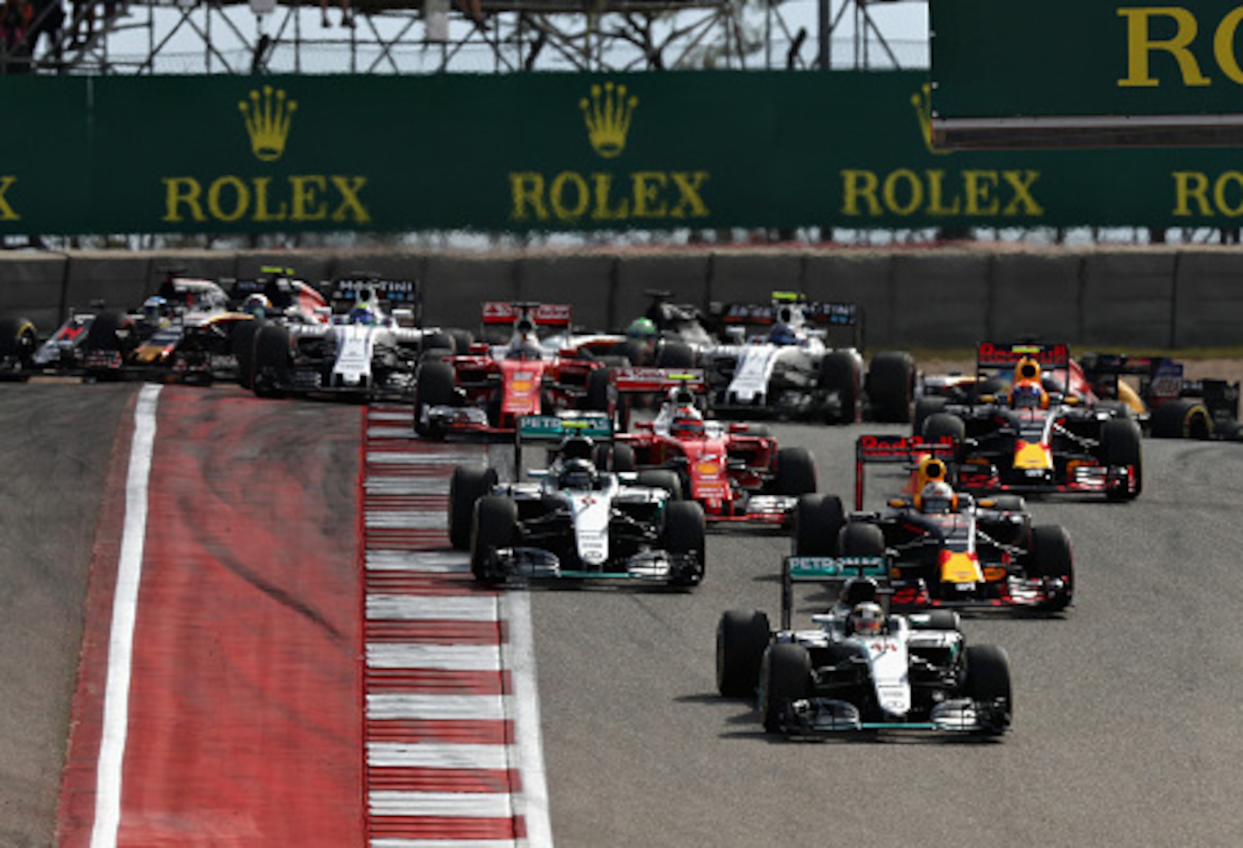 Lewis Hamilton leads the field on the first lap of the U.S. Grand Prix.