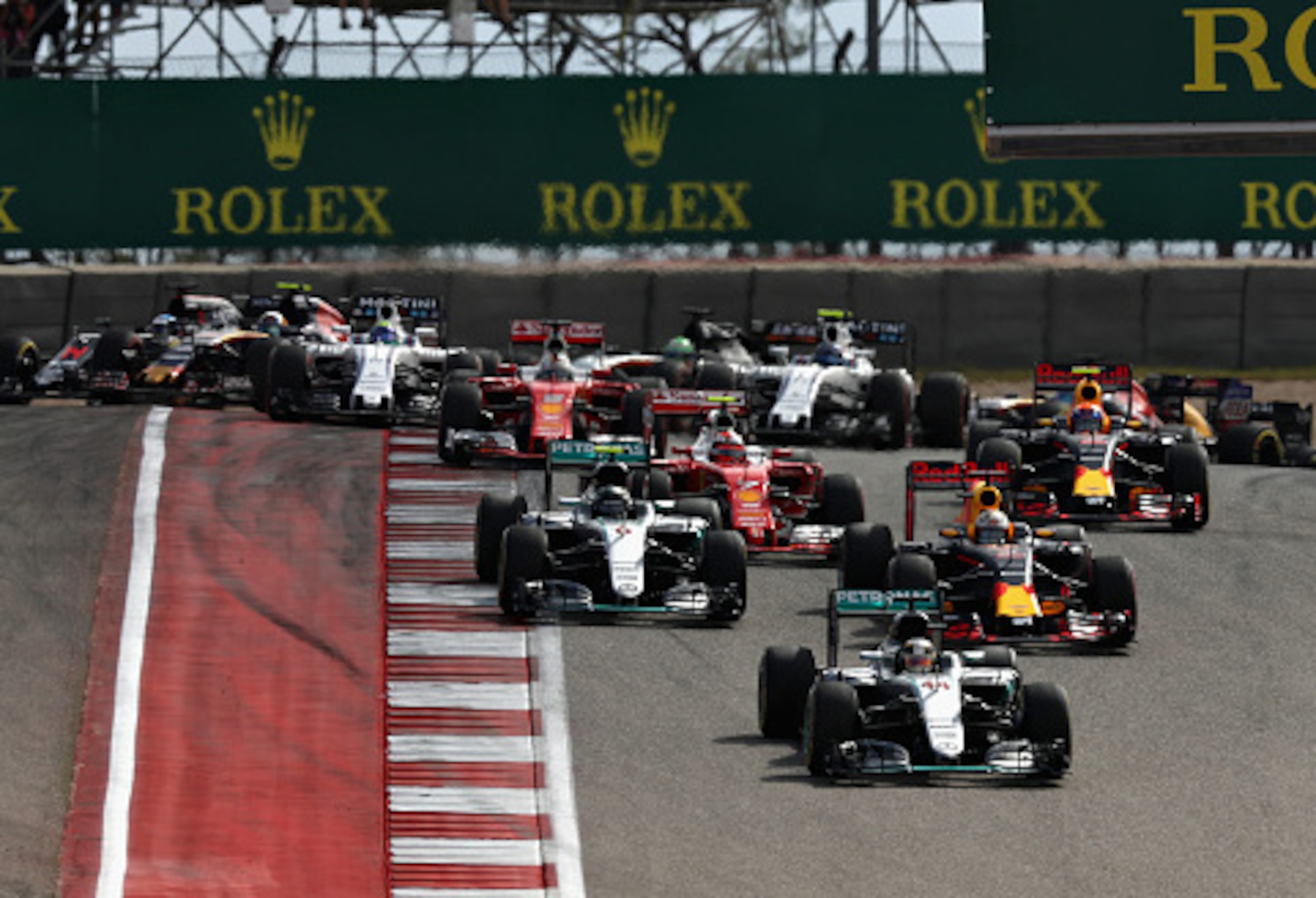 Lewis Hamilton leads the field on the first lap of the U.S. Grand Prix.