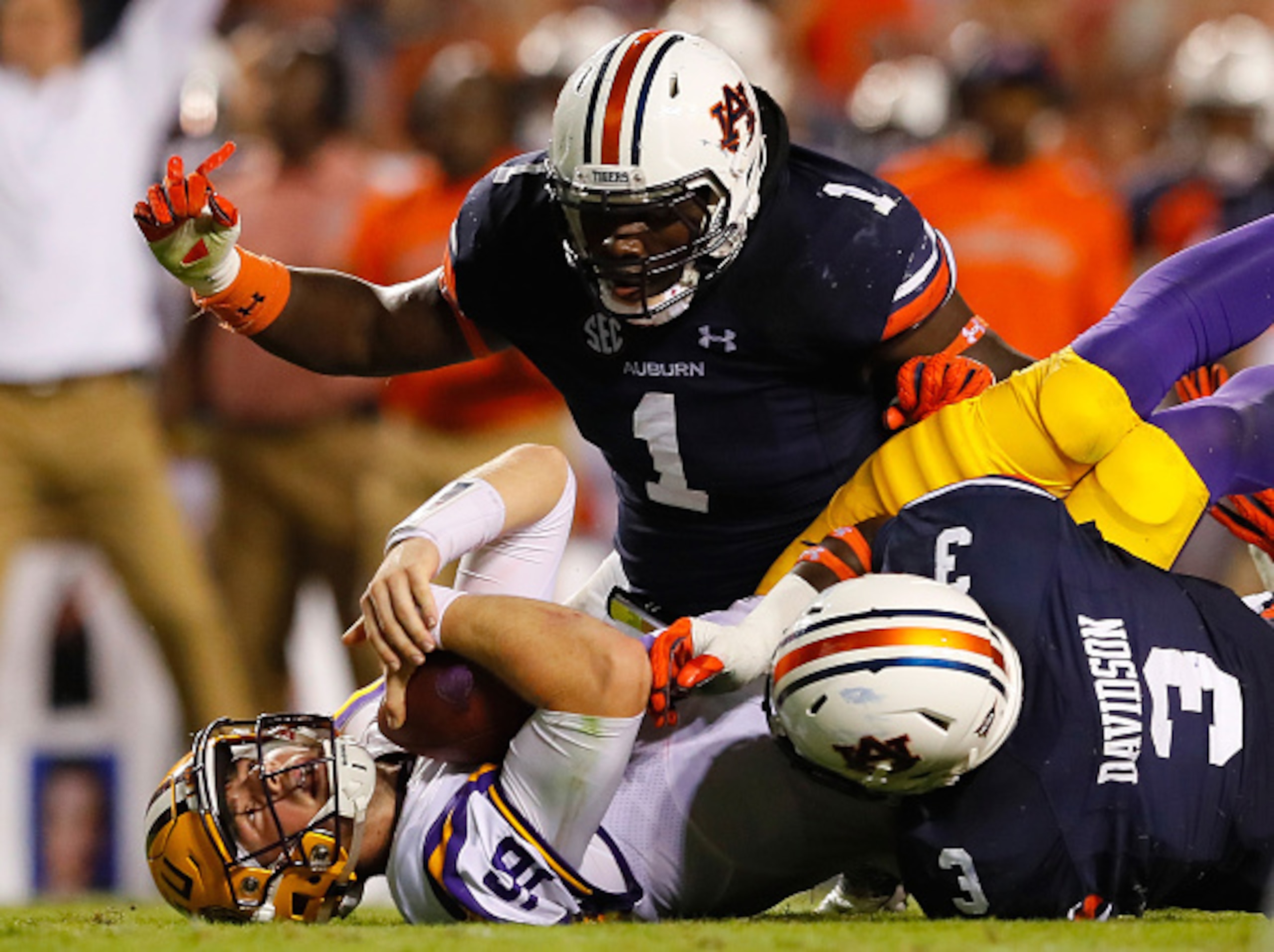 Auburn DT Montravius Adams (top) and end Marlon Davidson (right)