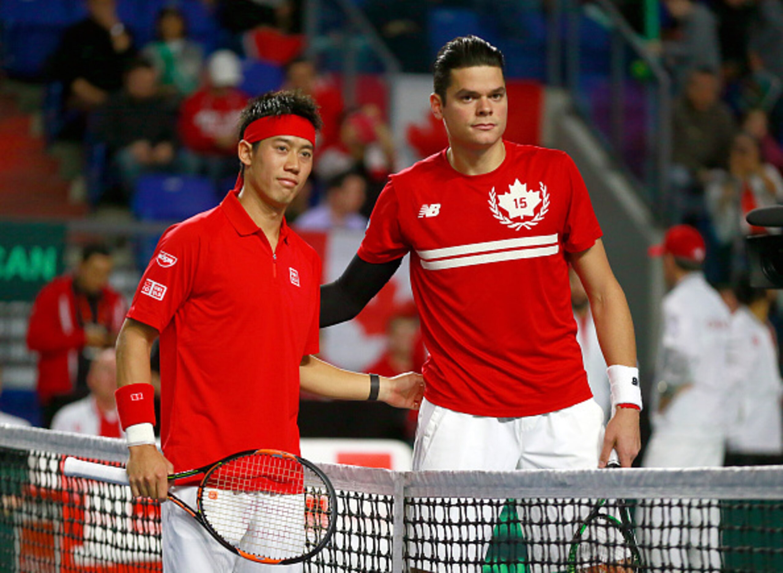 Kei Nishikori, left, and Milos Raonic pose before a 2015 Davis Cup match.