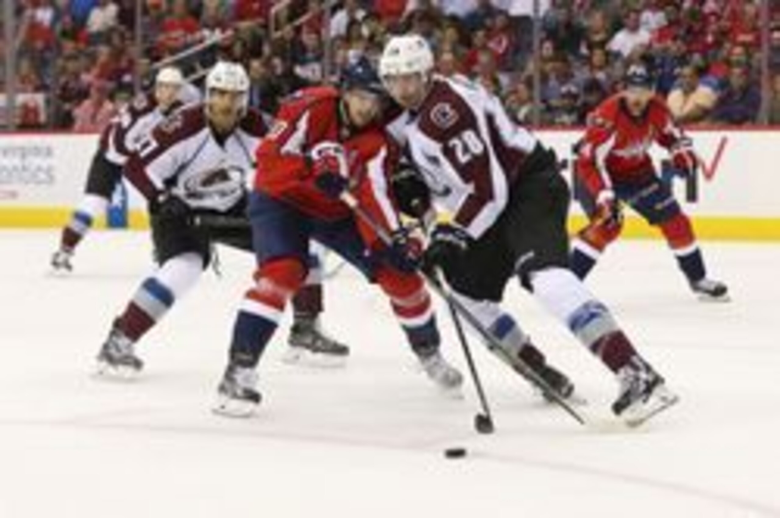 Oct 18, 2016; Washington, DC, USA; Washington Capitals center Lars Eller (20) and Colorado Avalanche defenseman Patrick Wiercioch (28) battle for the puck in the first period at Verizon Center. The Capitals won 3-0. Mandatory Credit: Geoff Burke-USA TODAY