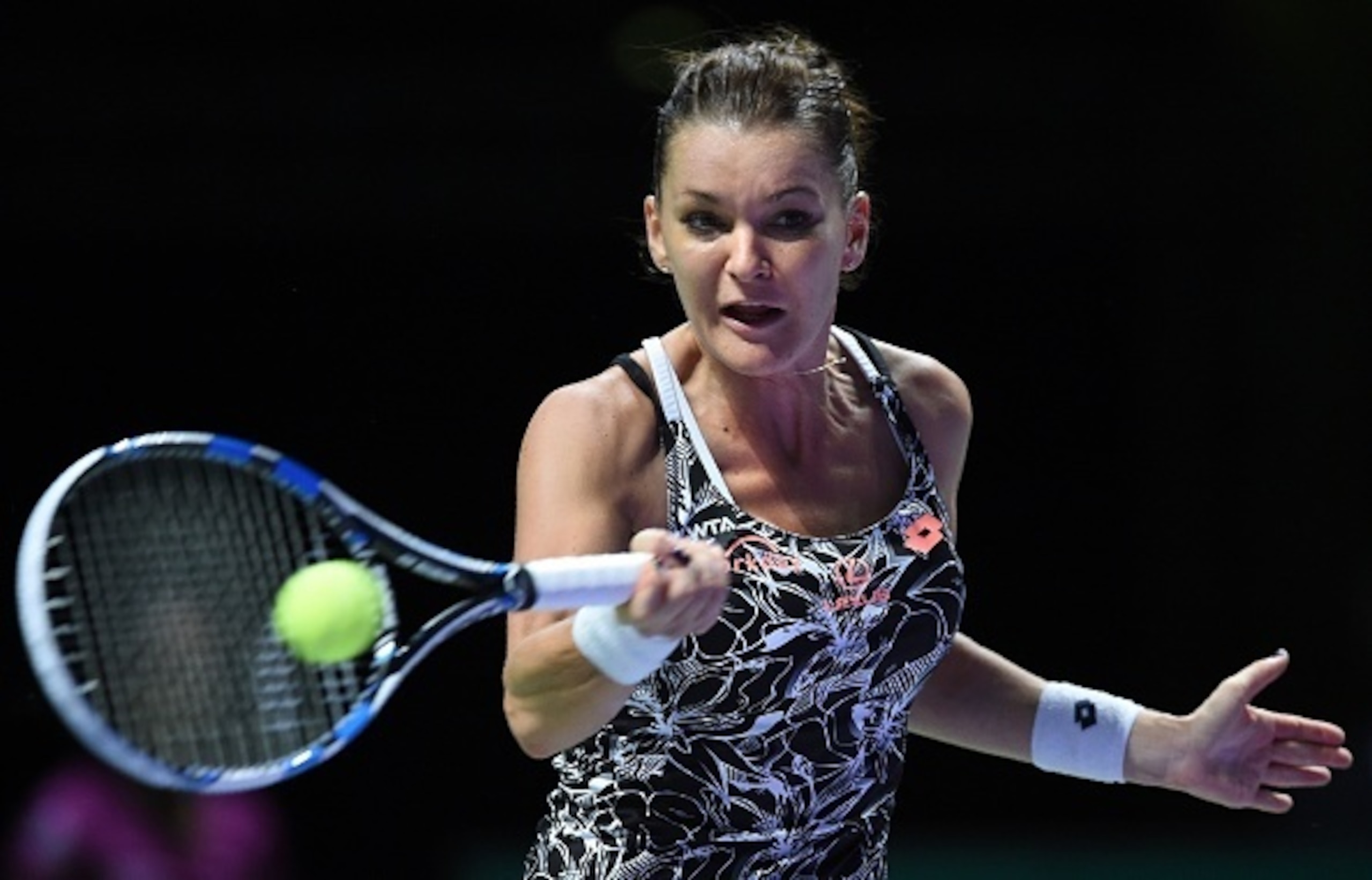 Agnieszka Radwanska hits a forehand during a match at the 2016 WTA Finals.