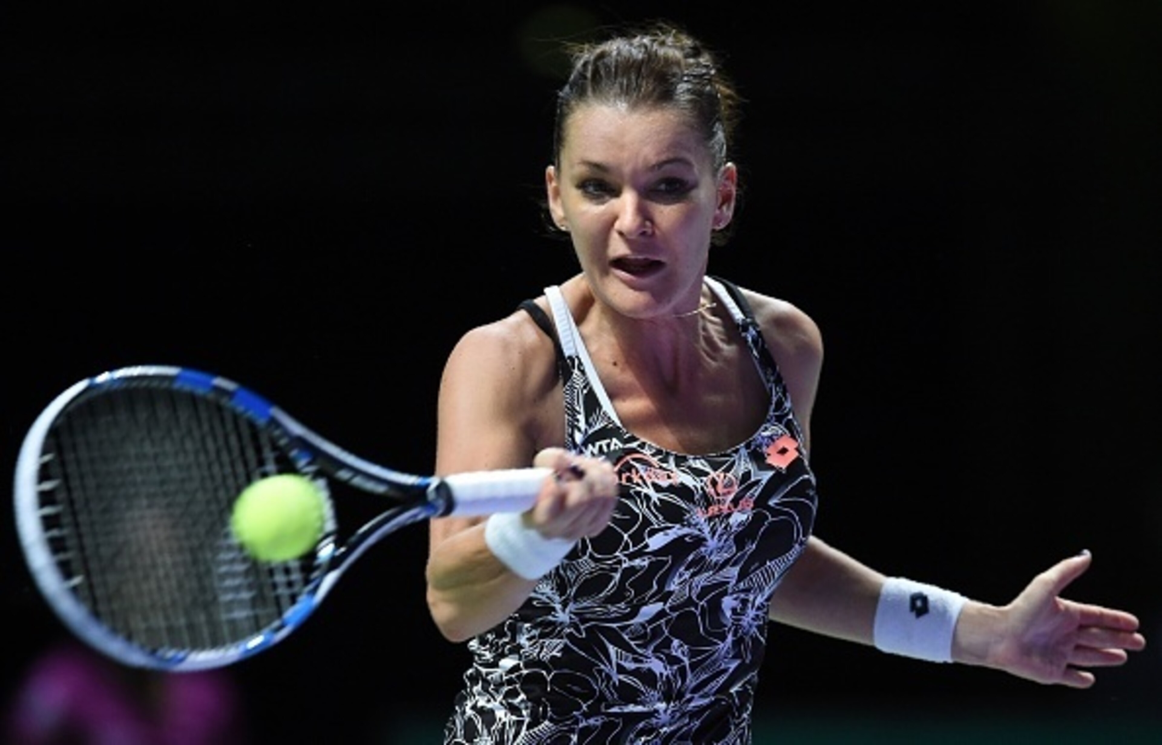 Agnieszka Radwanska hits a forehand during a match at the 2016 WTA Finals.