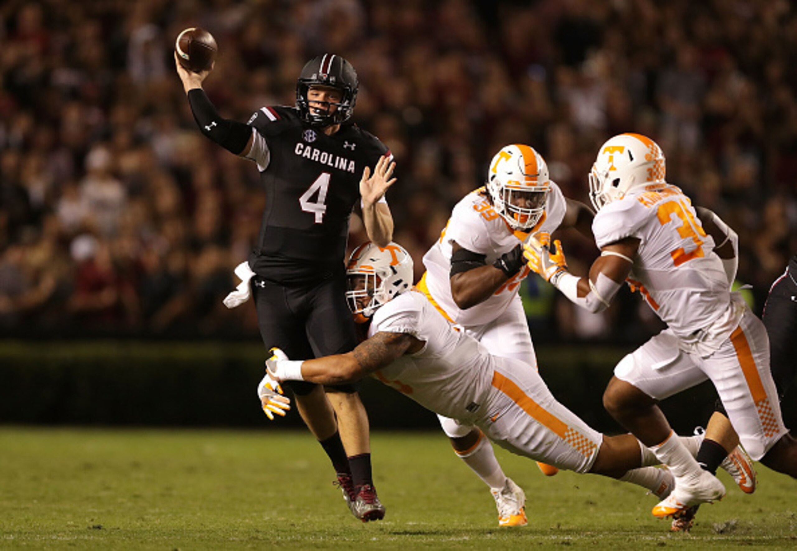 Tennessee's Derek Barnett (No. 4) hits the quarterback against South Carolina.