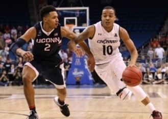 Jalen Adams (2) and Troy Caupain (10)