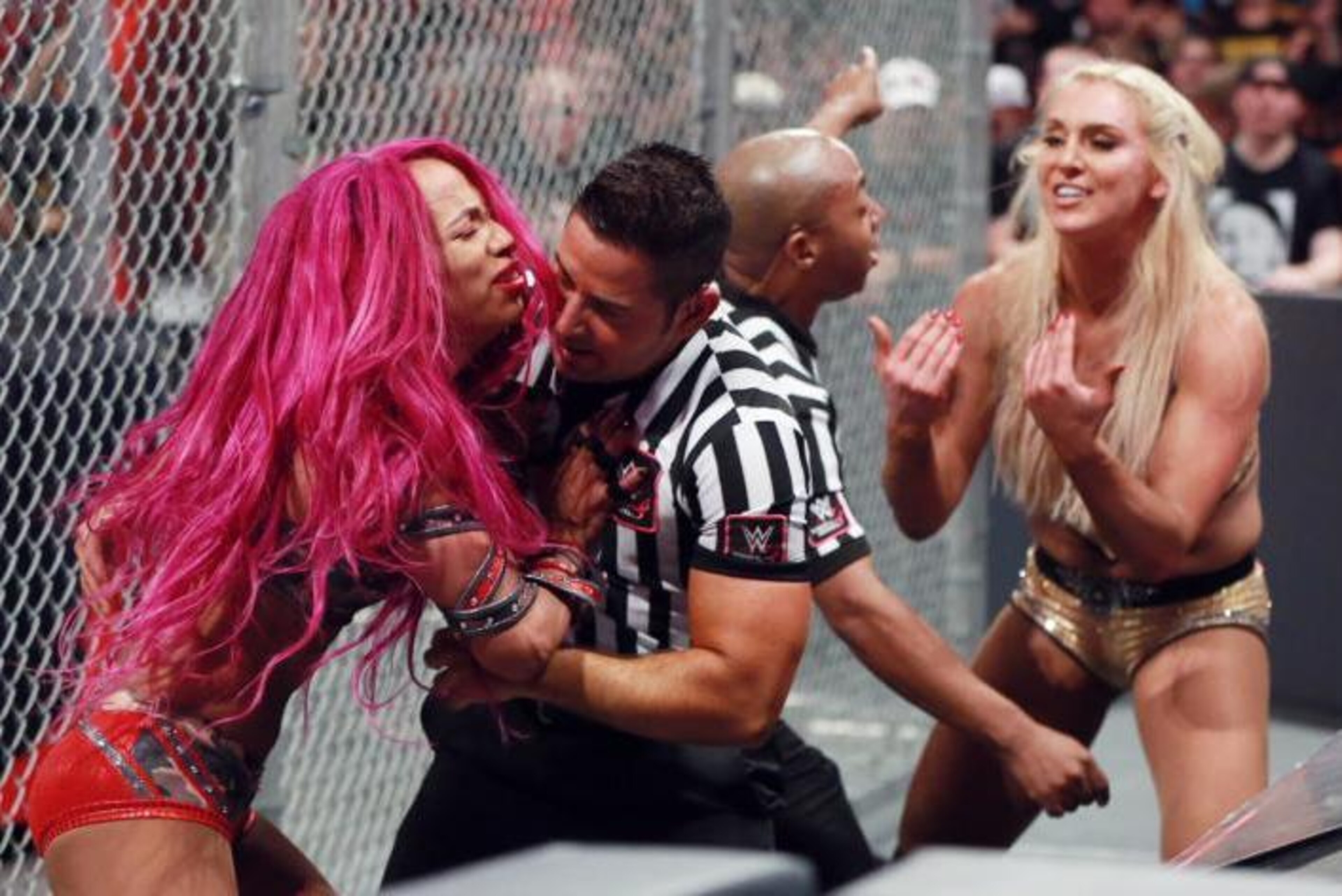Sasha Banks and Charlotte made history at WWE Hell in a Cell 2016. Sasha Banks and Charlotte made history at WWE Hell in a Cell 2016.