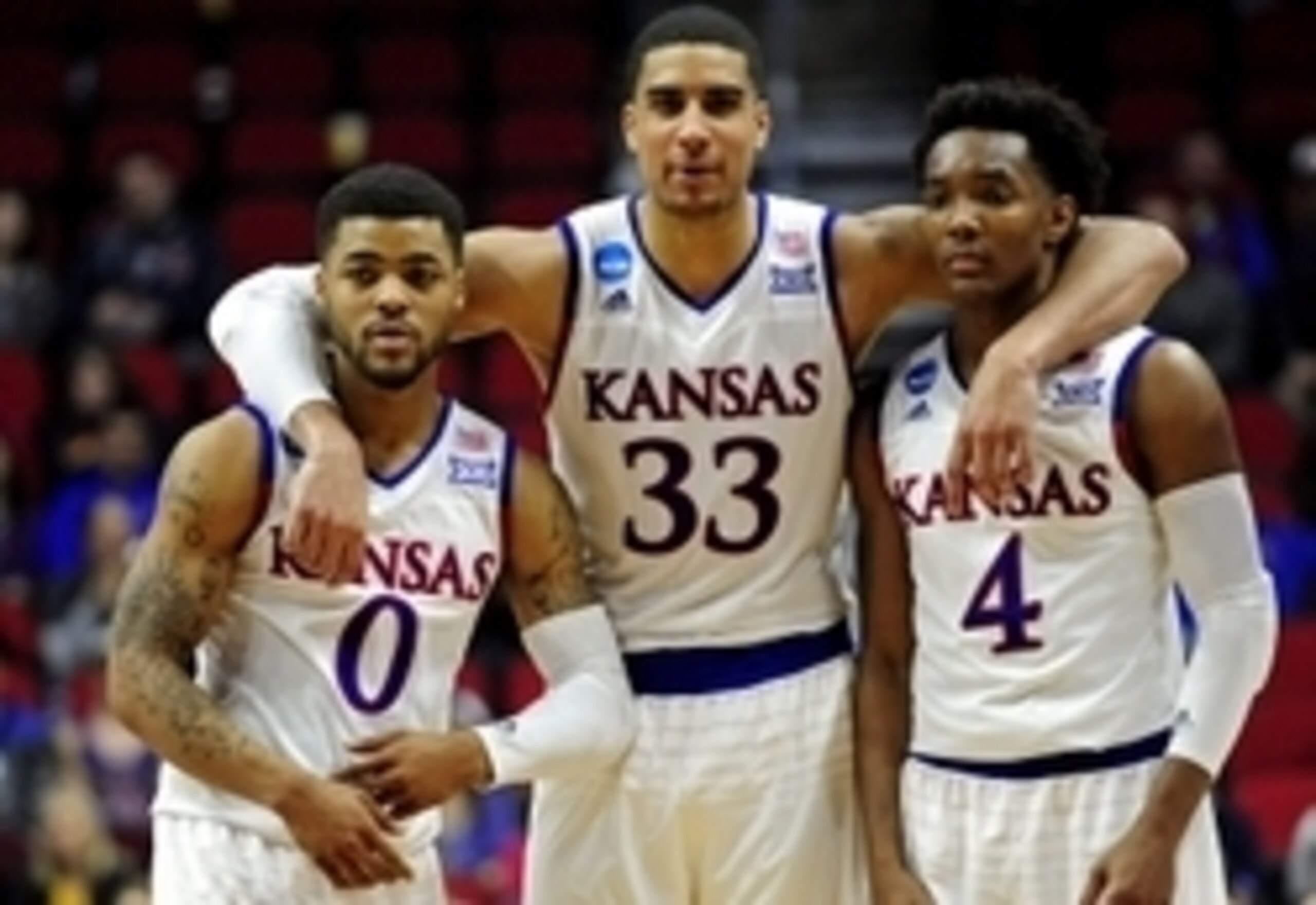 Mar 19, 2016; Des Moines, IA, USA; Kansas Jayhawks guard Frank Mason III (0), forward Landen Lucas (33) and guard Devonte' Graham (4) on the court in the second half against the Connecticut Huskies during the second round of the 2016 NCAA Tournament at We