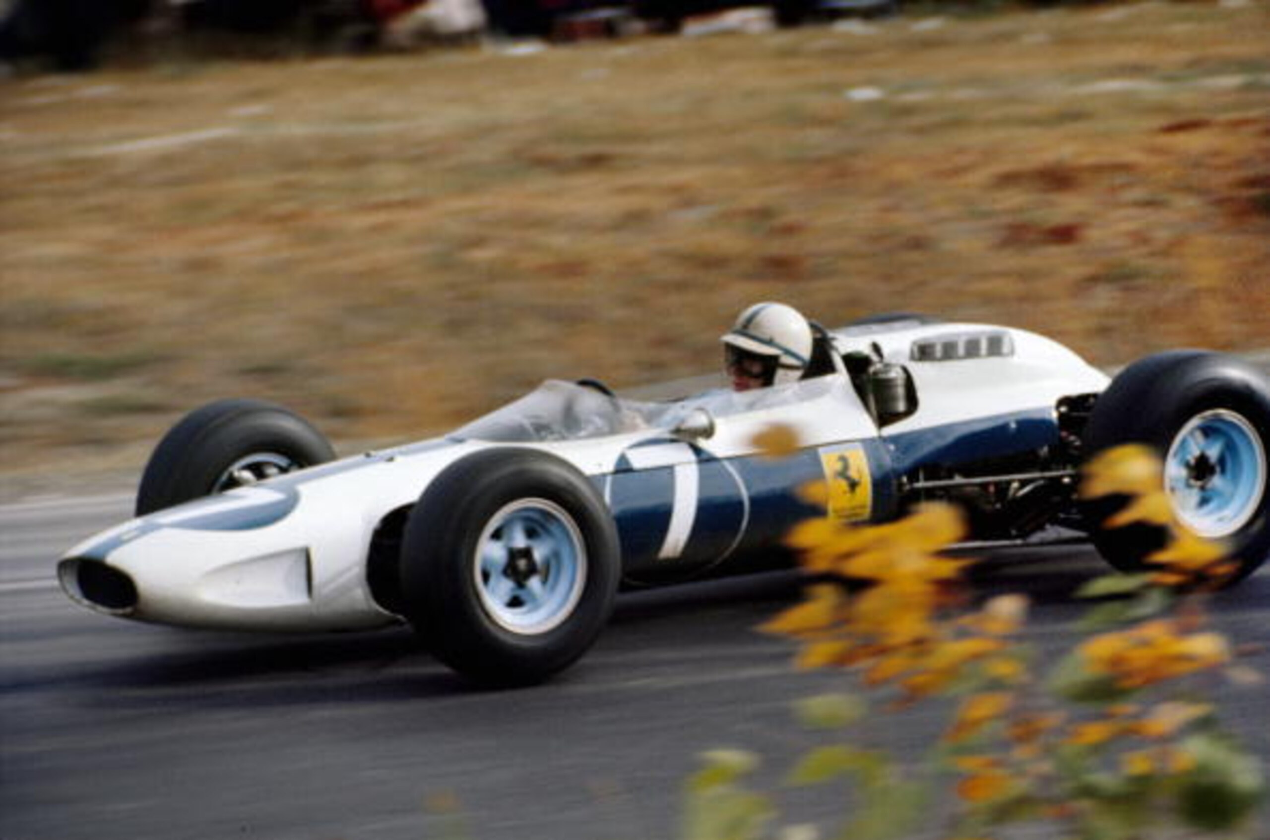 WATKINS GLEN, NY - OCTOBER 4: John Surtees in his Ferrari entered by Luigi Chinetti's NART (North American Racing Team) as there was a dispute with Ferrari who would not allow the cars painted in the traditional Ferrari red.  Surtees finished second at th