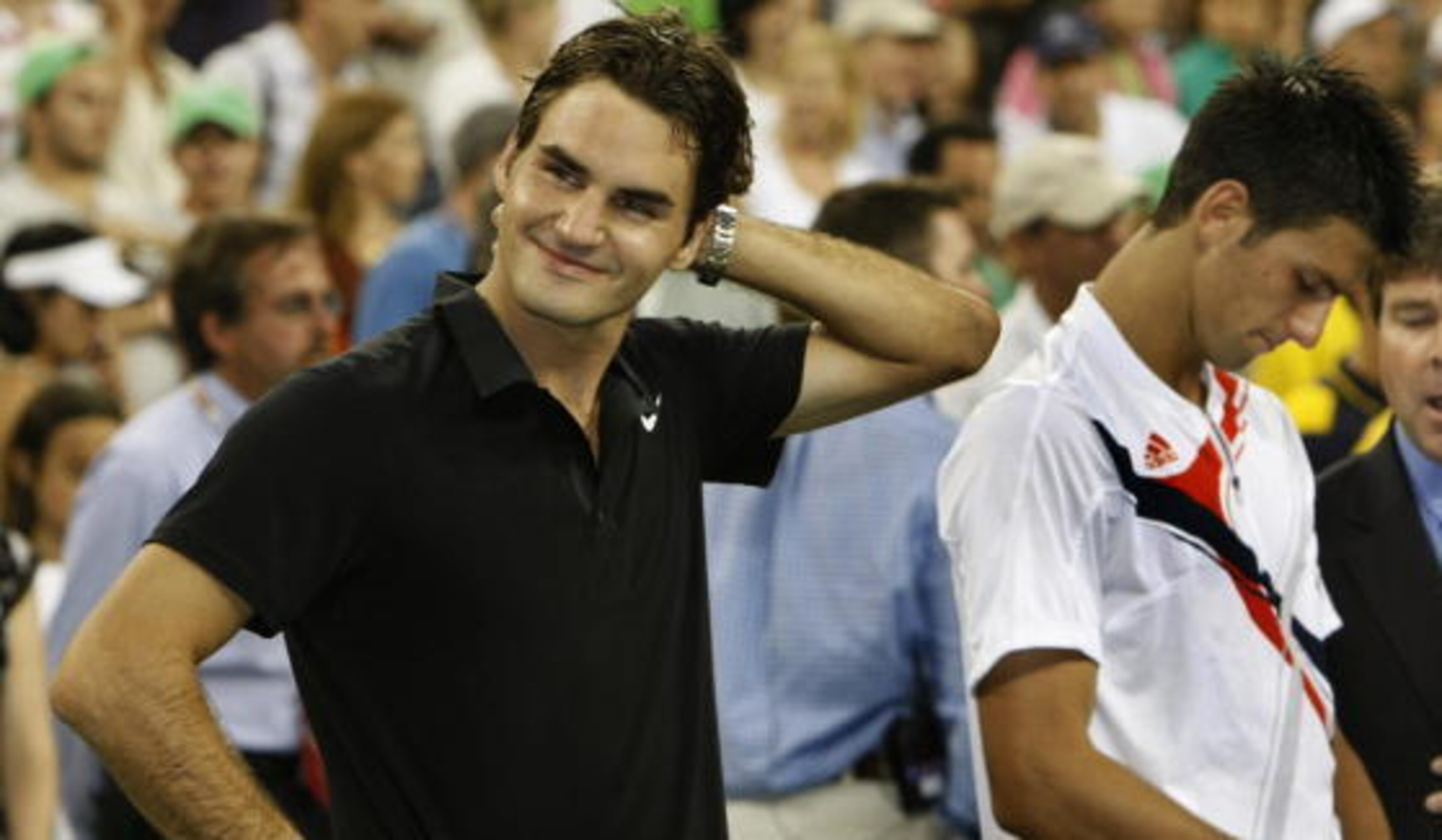 Roger Federer (R) of Switzerland and Serbia's Novak Djokovic attend the trophy ceremony after Federer defeated Djokvic in the US Open men's final at the USTA National Tennis Center in Flushing Meadows, New York, 09 September 2007. Federer won 7-6 (7/4), 7