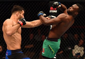 Gegard Mousasi (left) lands a punch on Uriah Hall.