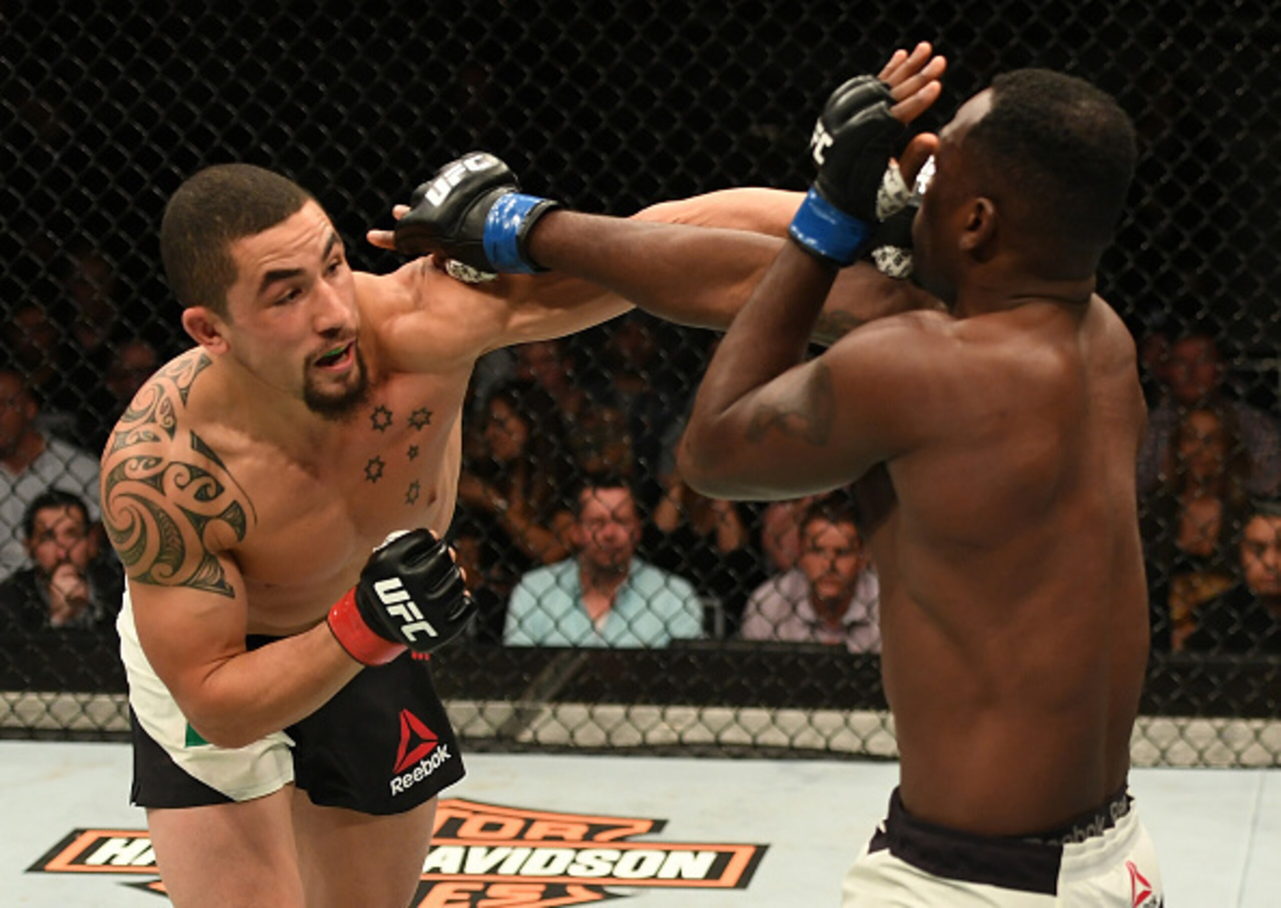 Robert Whittaker punches Derek Brunson.