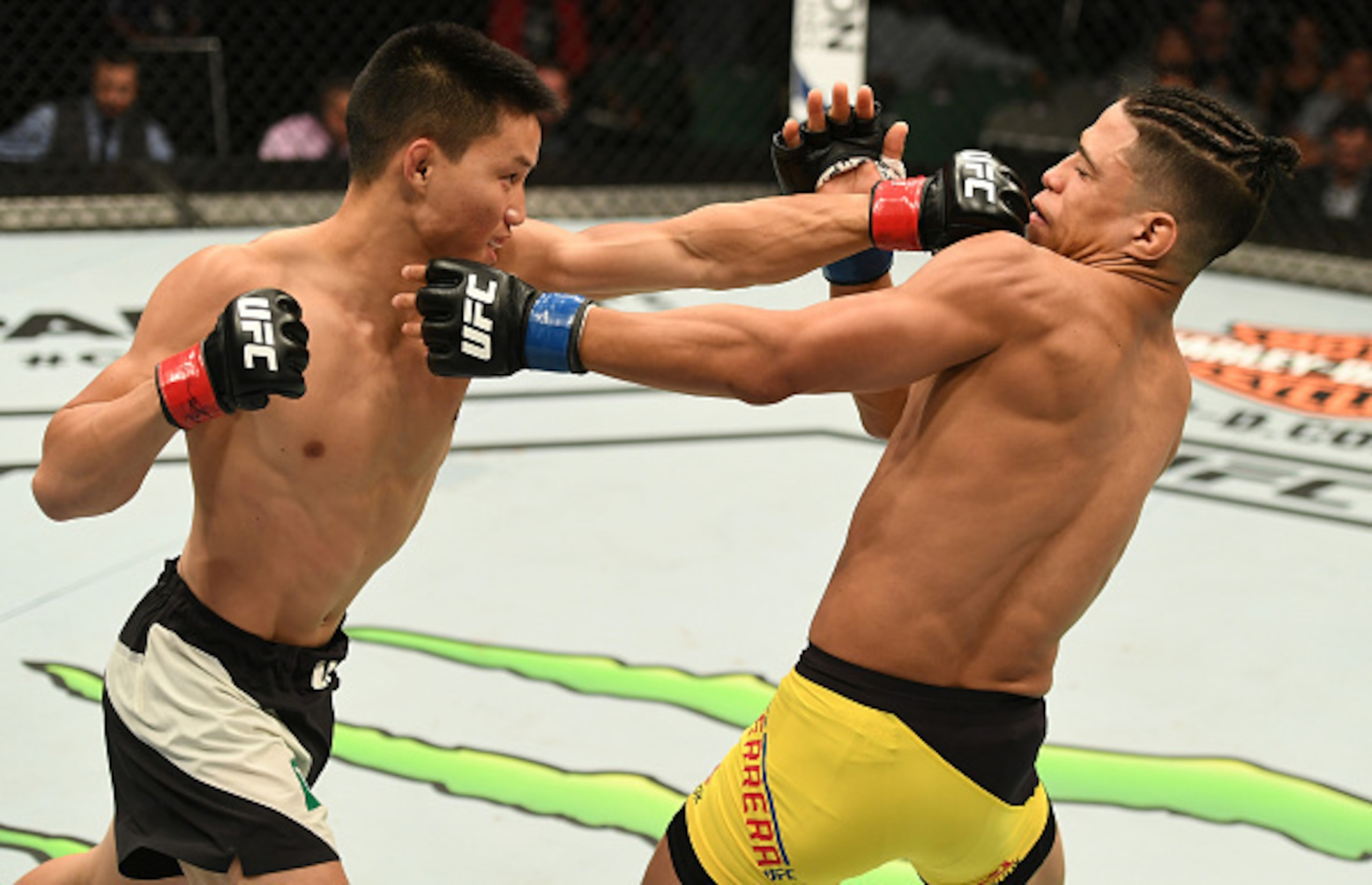 Ben Nguyen (left) punches Geane Herrera