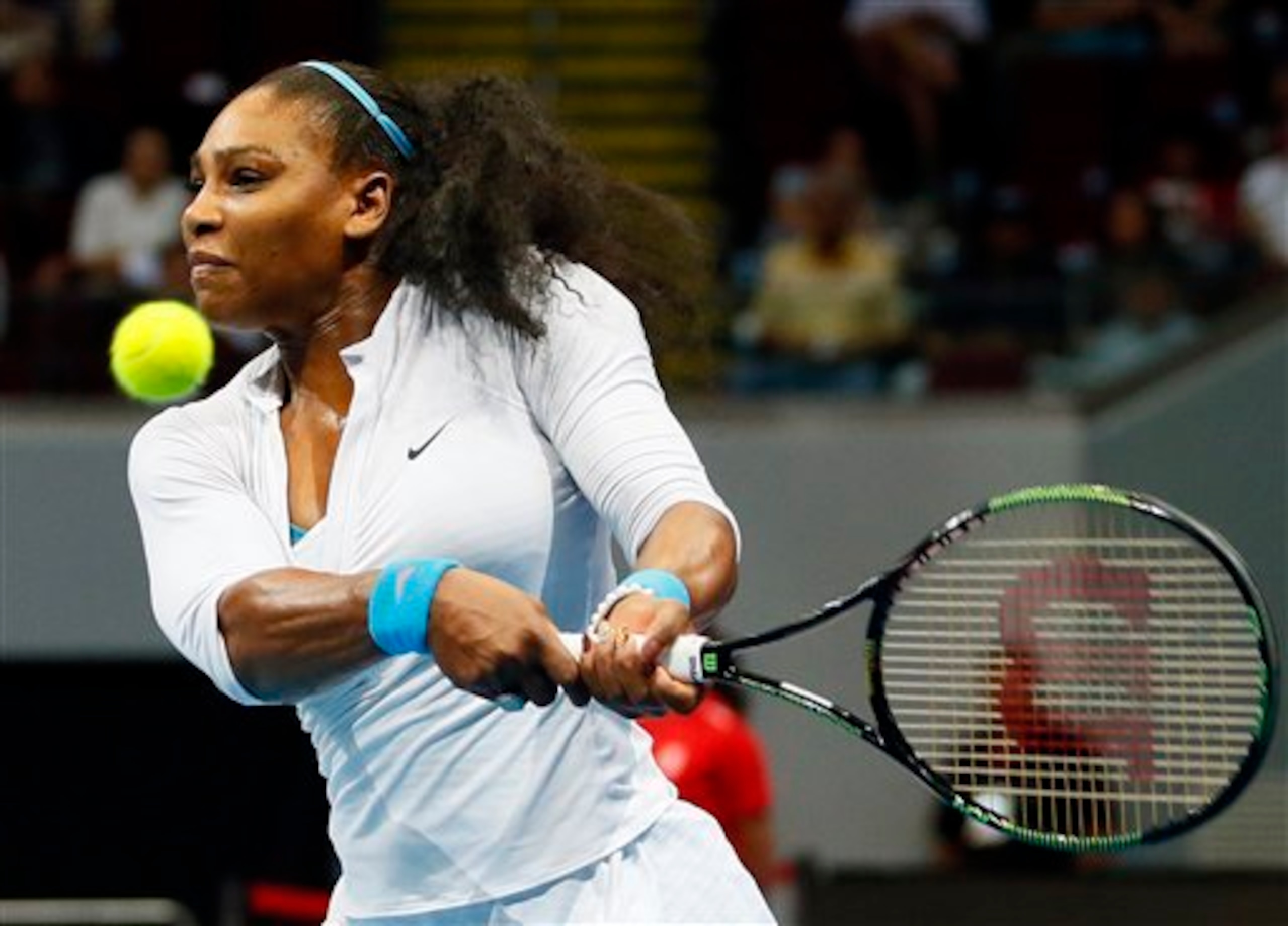 Serena Williams hits a backhand during a 2015 IPTL event.