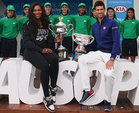 Serena Williams and Novak Djokovic show off 2015 Australian Open trophies before the draw ceremony for the 2016 tournament.