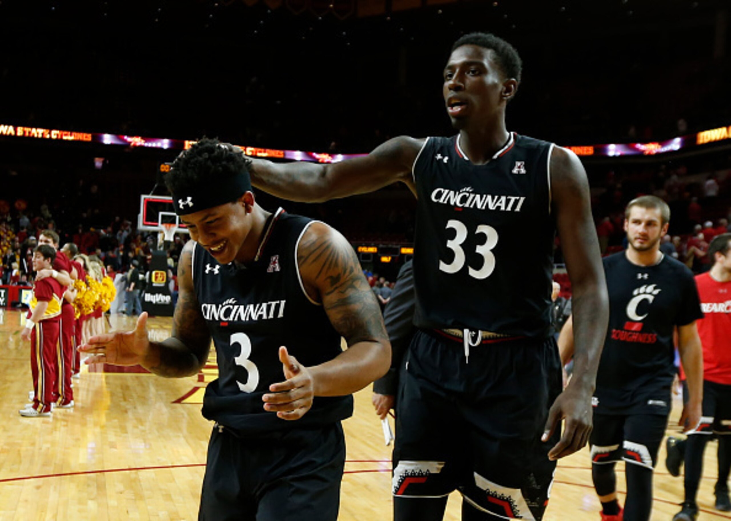Nysier Brooks (33) and Justin Jenifer (3) celebrate a marquee win over Iowa State.