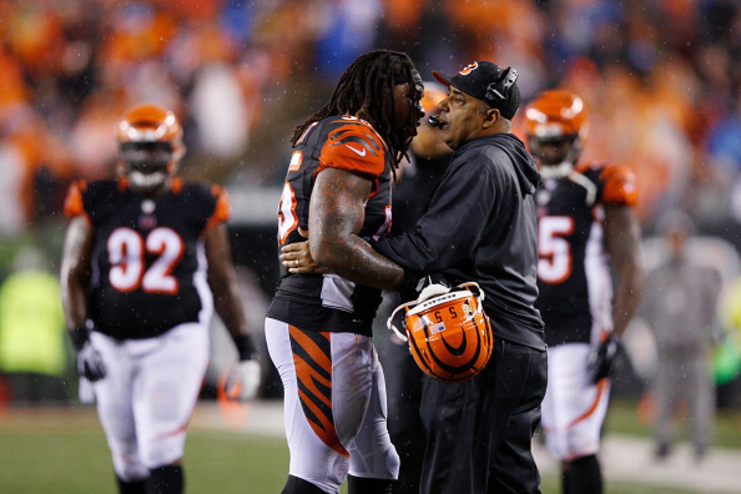 CINCINNATI, OH - JANUARY 9: Vontaze Burfict #55 of the Cincinnati Bengals is grabbed by head coach Marvin Lewis in the second half of the AFC Wild Card Playoff game against the Pittsburgh Steelers at Paul Brown Stadium on January 9, 2016 in Cincinnati, Oh