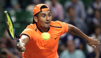 Nick Kyrgios hits a forehand volley during an exhibition in New York.