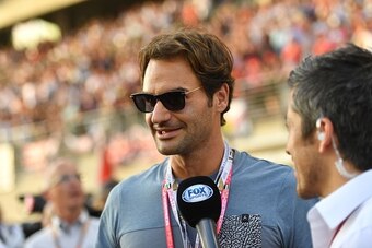 Federer taking in a Formula One race during his offseason.