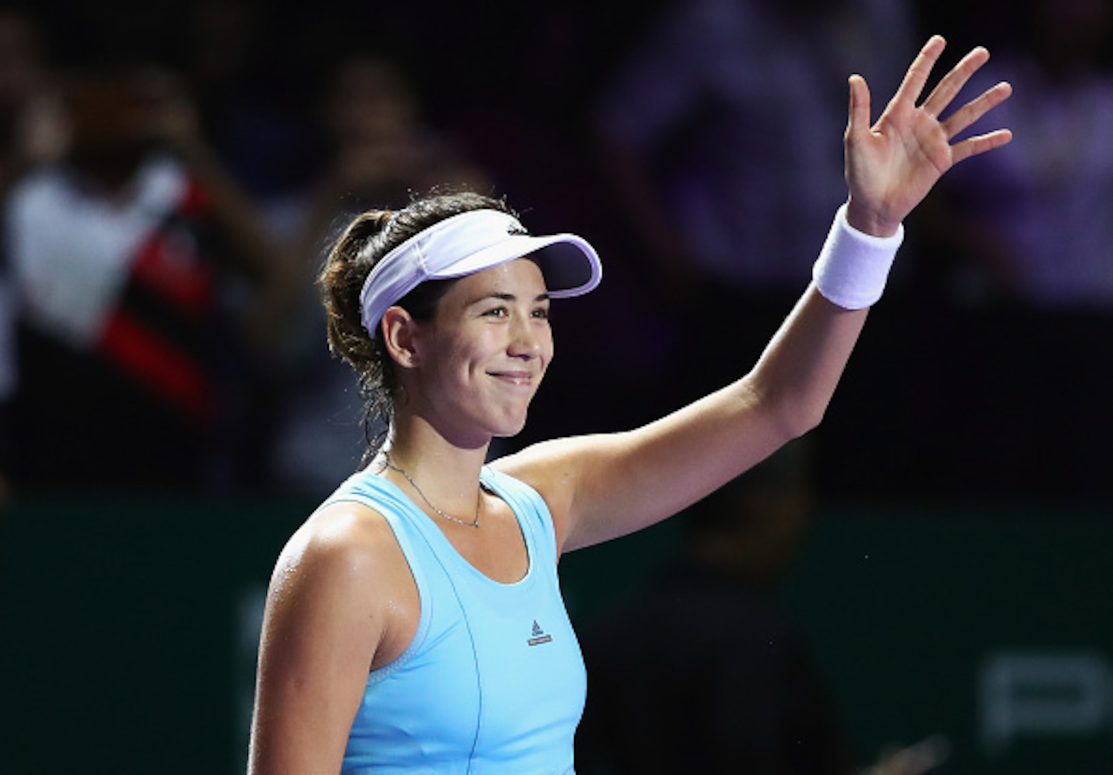 Muguruza waves to the Singapore crowd at the WTA Finals.
