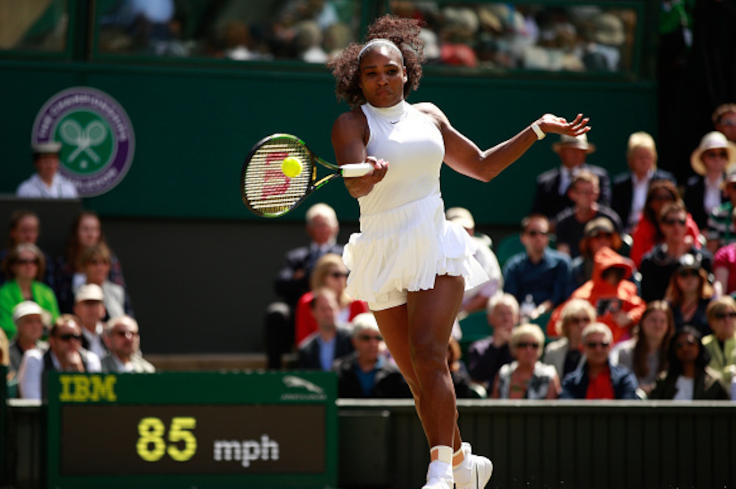 Serena Williams hits a forehand during 2016 Wimbledon.