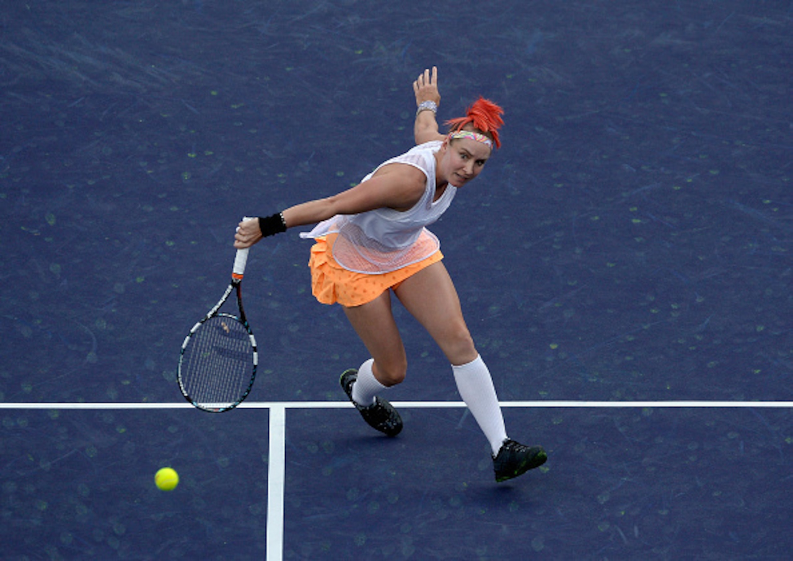 Bethanie Mattek-Sands hits a backhand slice during a match at BNP Paribas Open at Indian Wells.