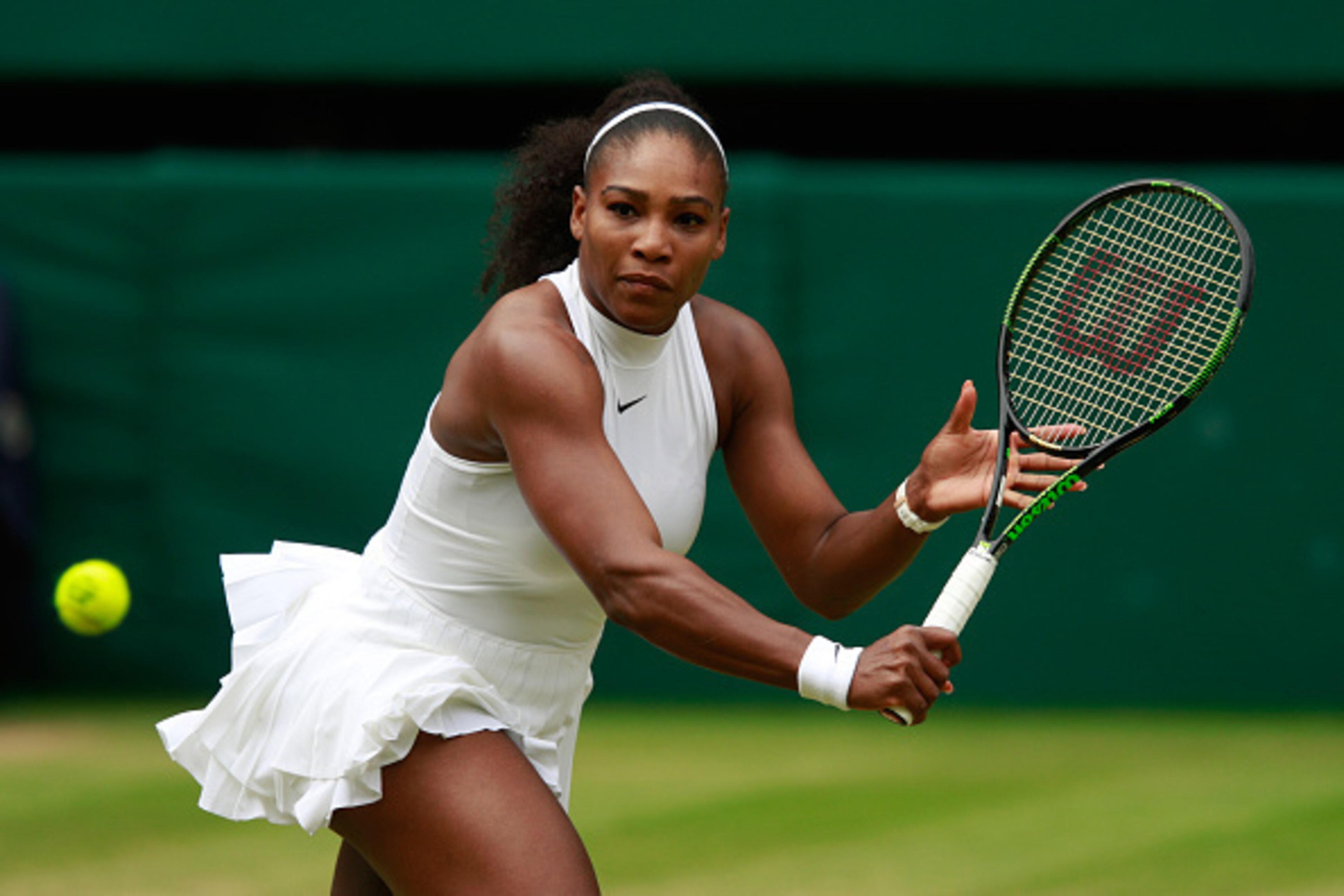 Serena Williams hits a backhand slice during the 2016 Wimbledon finals.