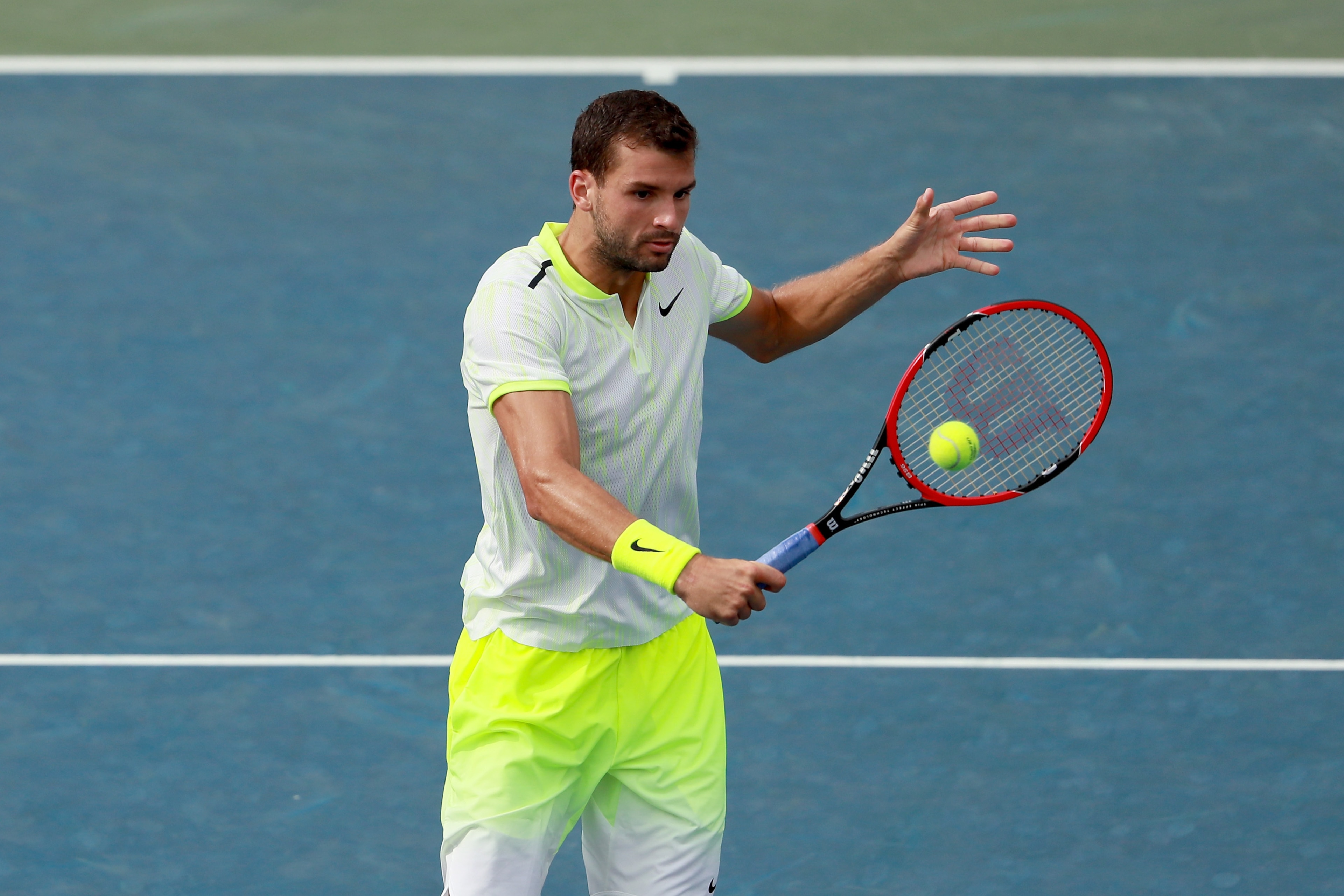Grigor Dimitrov hits a backhand during a match at the 2016 U.S. Open.
