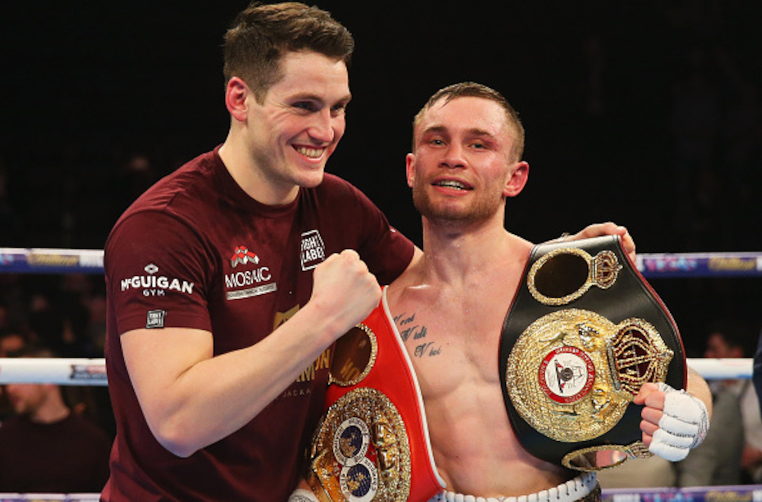 MANCHESTER, ENGLAND - FEBRUARY 27:  Carl Frampton celebrates with trainer Shane McGuigan after a points victory over Scott Quigg after the World Super-Bantamweight title contest at Manchester Arena on February 27, 2016 in Manchester, England. Frampton's v