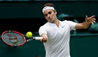 Roger Federer hits a forehand during a match at Wimbledon, 2016.
