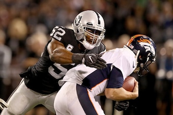 OAKLAND, CA - NOVEMBER 06:  Khalil Mack #52 of the Oakland Raiders sacks Trevor Siemian #13 of the Denver Broncos on November 6, 2016 in Oakland, California.  (Photo by Ezra Shaw/Getty Images)