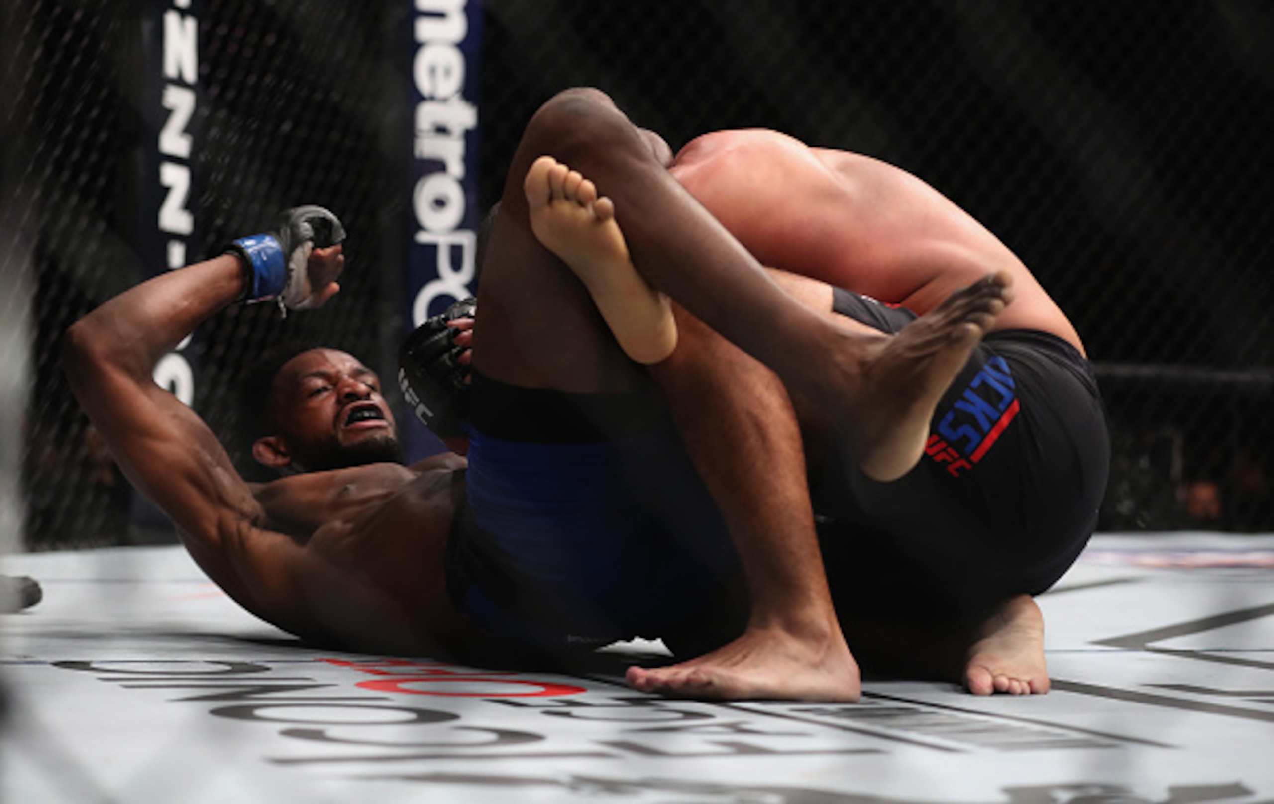 Neil Magny (left) elbows Johny Hendricks