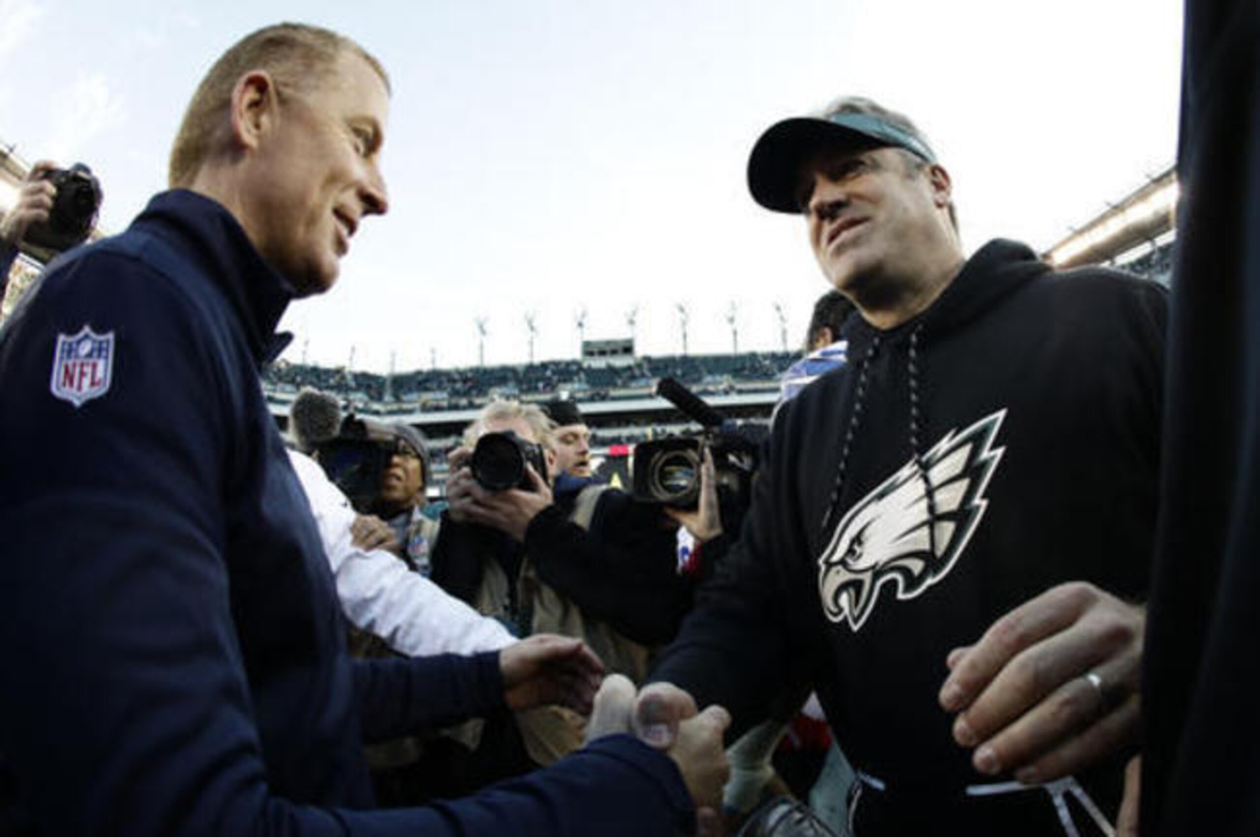 Jason Garrett, left, chose to play conservatively against the Eagles with the playoffs approaching.