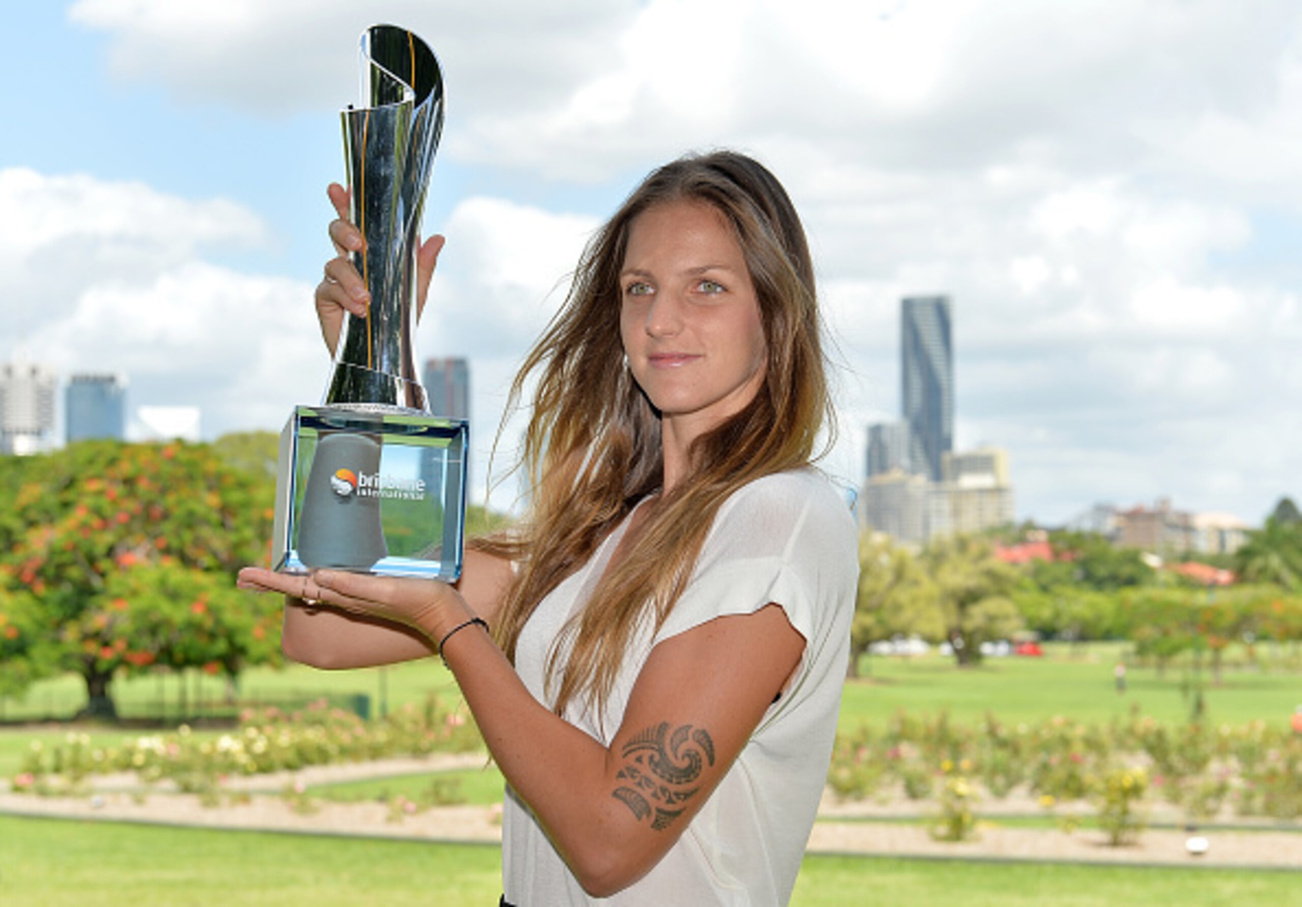Karolina Pliskova shows off her trophy after winning the 2017 Brisbane tournament.