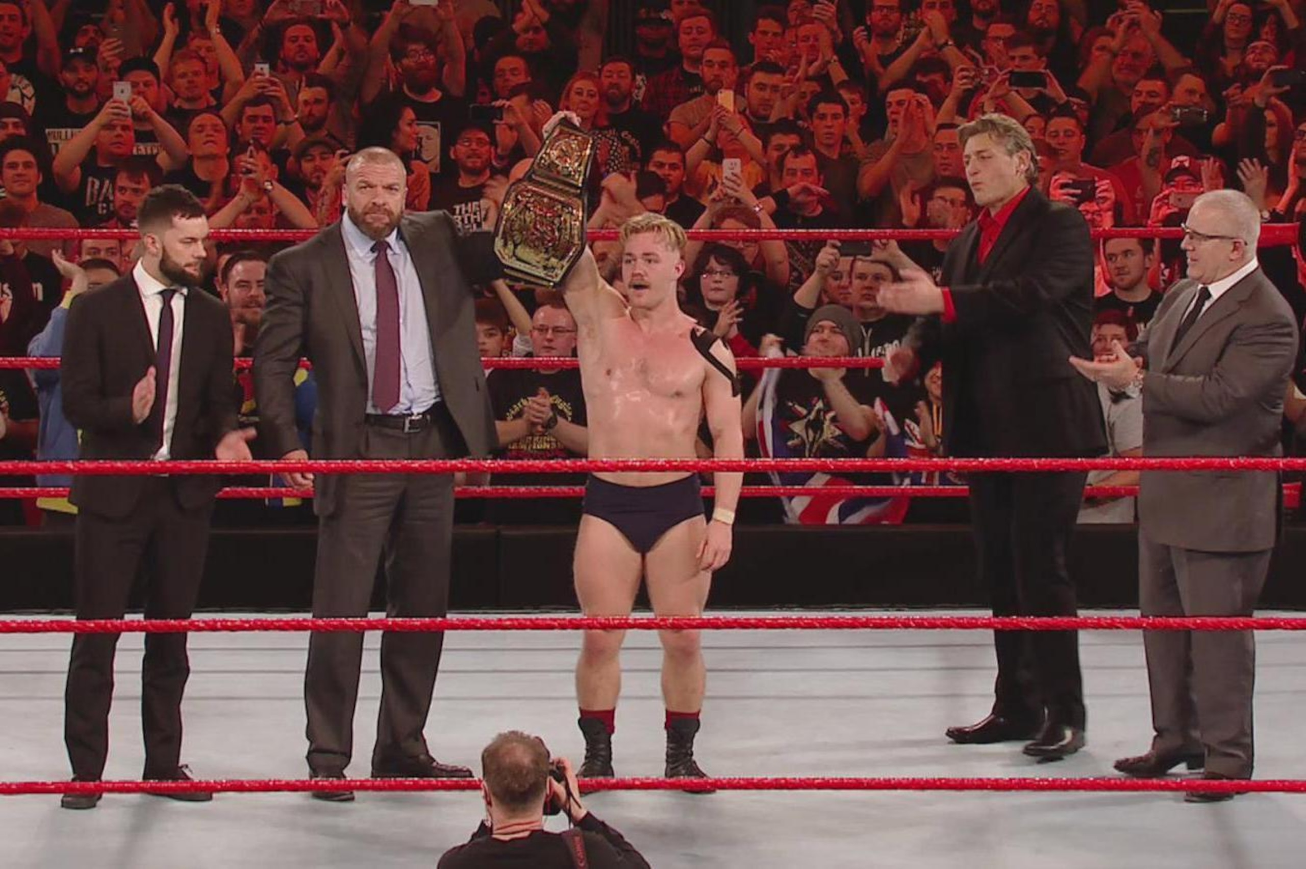 Tyler Bate celebrating the biggest win of his life. Tyler Bate celebrating the biggest win of his life.