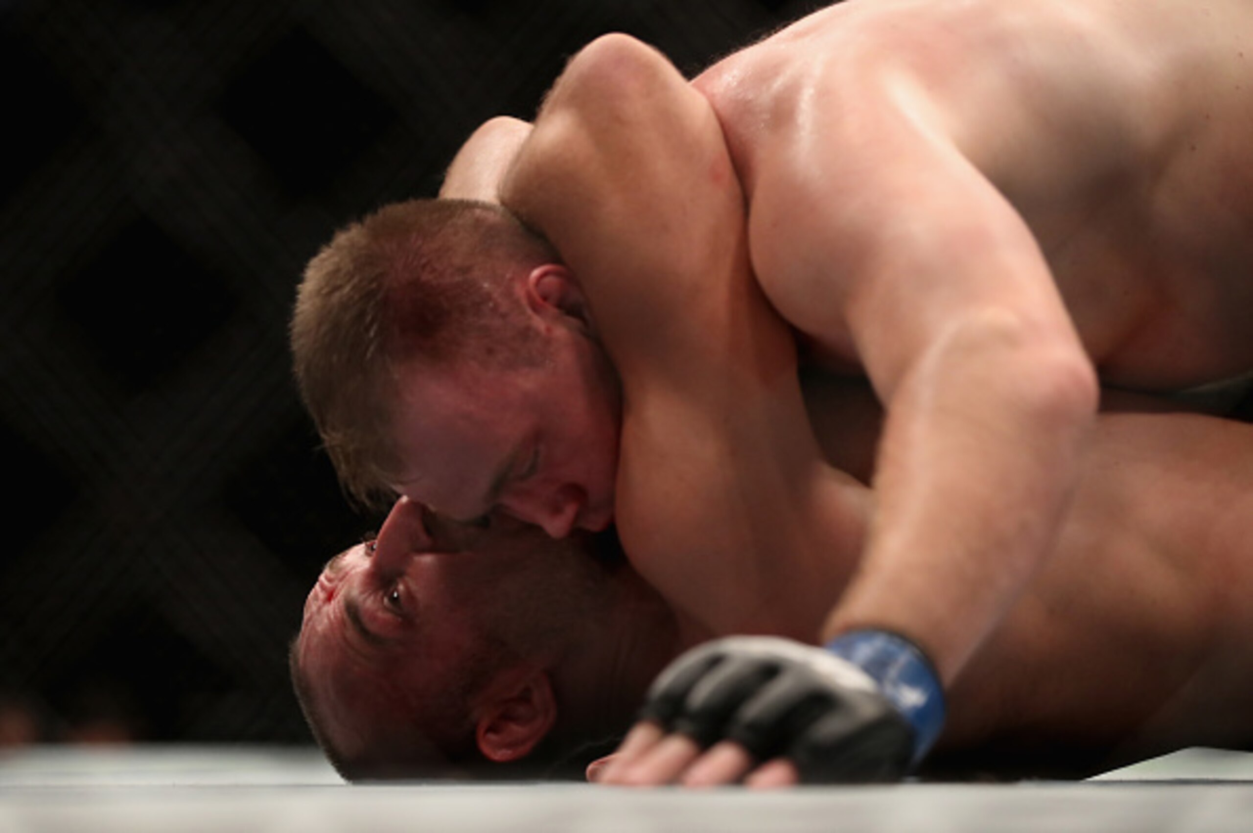 Oleinik, below, stunned fans by winning the fight from this exact position.