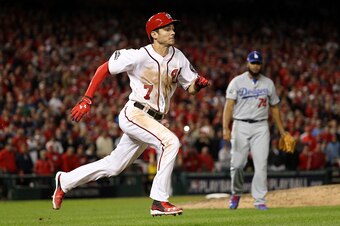 WASHINGTON, DC - OCTOBER 13: Trea Turner #7 of the Washington Nationals cannot make it to first base and is forced out for the the first out of the ninth inning against the Los Angeles Dodgers during game five of the National League Division Series at Nat