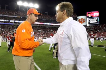 Clemson coach Dabo Swinney, left, and Alabama coach Nick Saban are set to add more elite players to talented rosters.