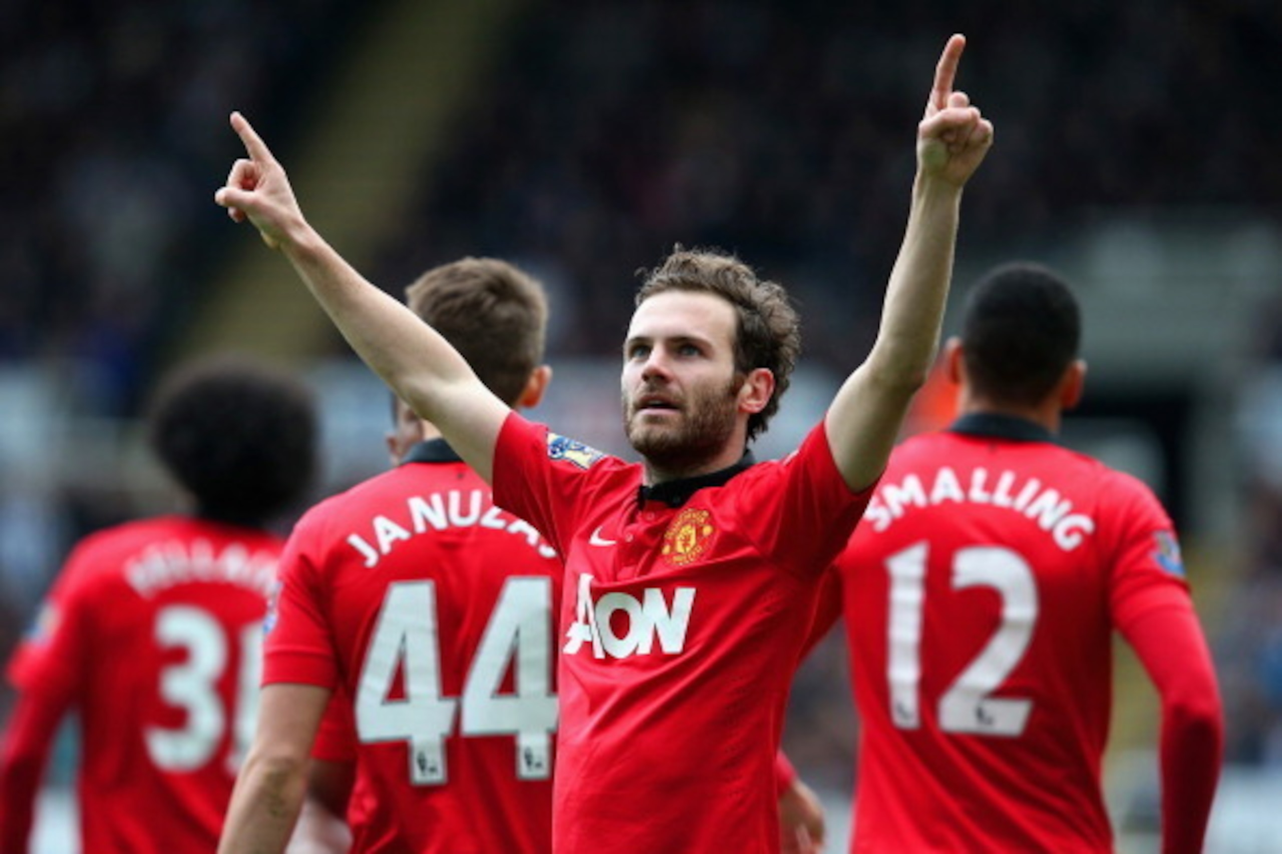 Juan Mata celebrates a goal against Newcastle at St James' Park.